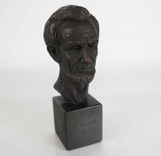 Leo CHERNE: Bust of Lincoln - Patinated Resin: Leo Cherne (American, 1912 - 1999) bronze patinated stone resin bust of Lincoln on base, signed center and on neck. [8" H x 3" W x 3 1/2" D]. In good condition.