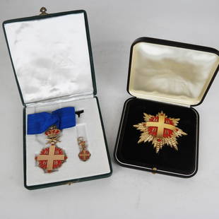 Two Boxed Religious or Military Cross Medals: Two beautiful boxed medals, both marked with forward and reversed "B"s; one a textured gold tone and red enamel medal [3 1/4" H x 3 1/4" W], the other a gold tone and red enamel cross hanging from a