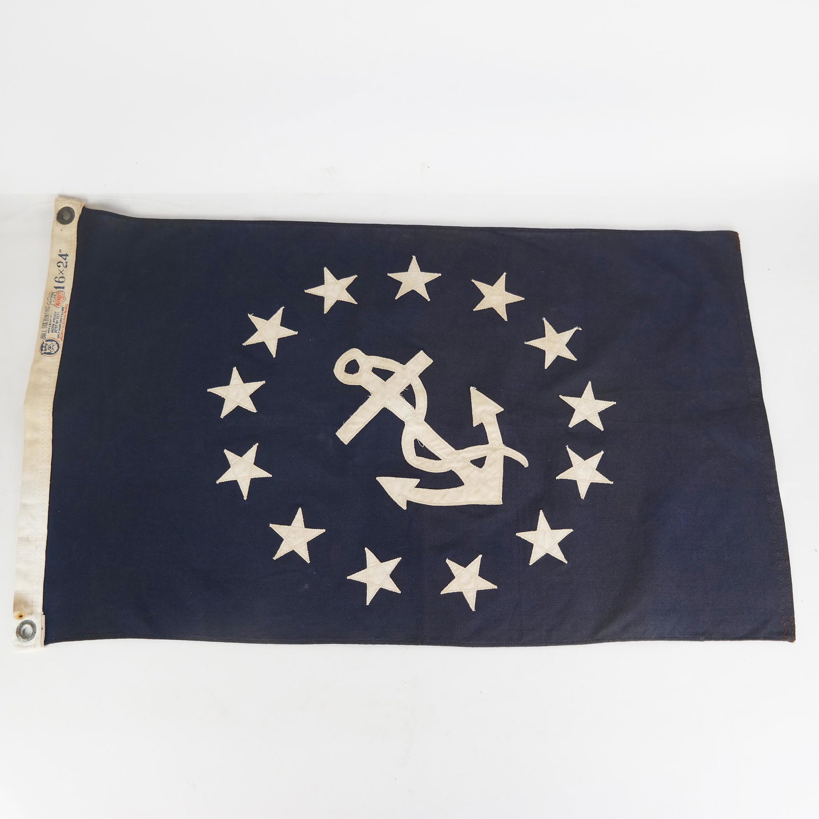 13-Star Naval Veteran's Association Ensign Bunting: 13-Star fouled anchor Naval Veteran's Association Ensign bunting by Bull Dog Bunting Co. [24" x 16"]. In good condition as with age.