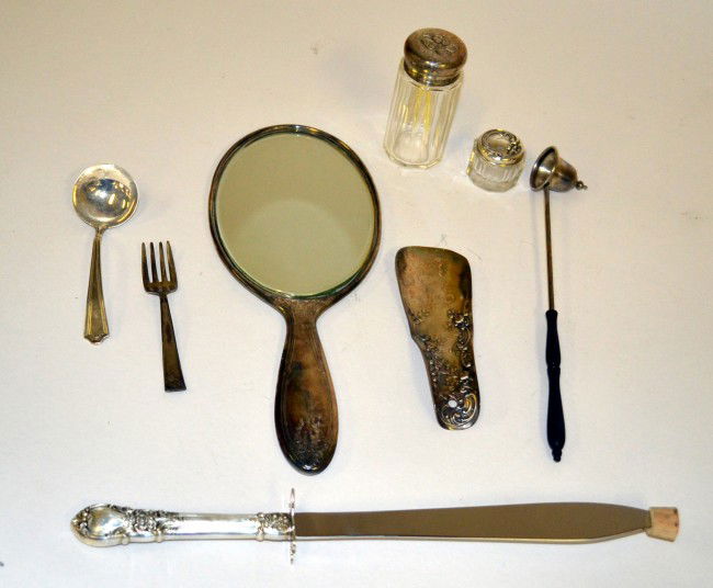 Assorted Sterling Silver Items: Including a hand mirror, shoe horn, candle snuffer, two bottles with silver tops, and a carving knife and fork. Measurements: