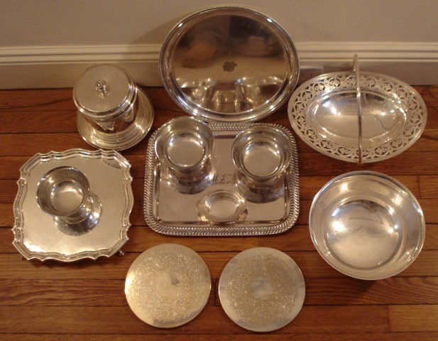 Silverplated Group: An assorted group of silverplate, including a reticulated oval basket, a round tray, a rectangular tray, salva, round bowl, footed biscuit box, thre engraved bowls, and two incised coasters. (11 piece