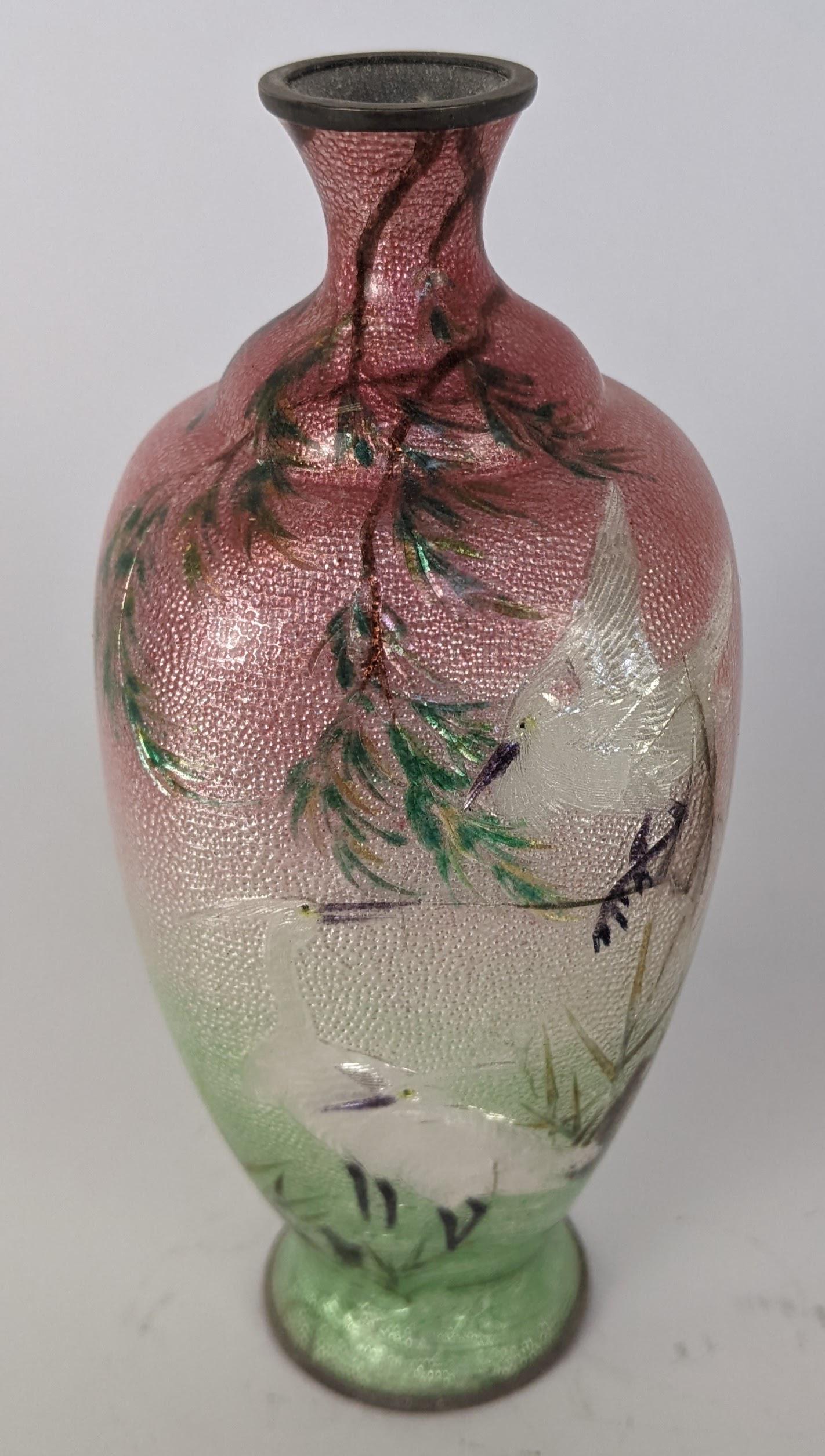 Japanese Cloisonne Enamel Vase: Japanese cloisonne enamel cabinet vase, bird decorated. Signed/stamped on bottom. From the Estate of June Hirsch Jones. [5 1/2" H x 2 1/4" Diam.]. In good condition.