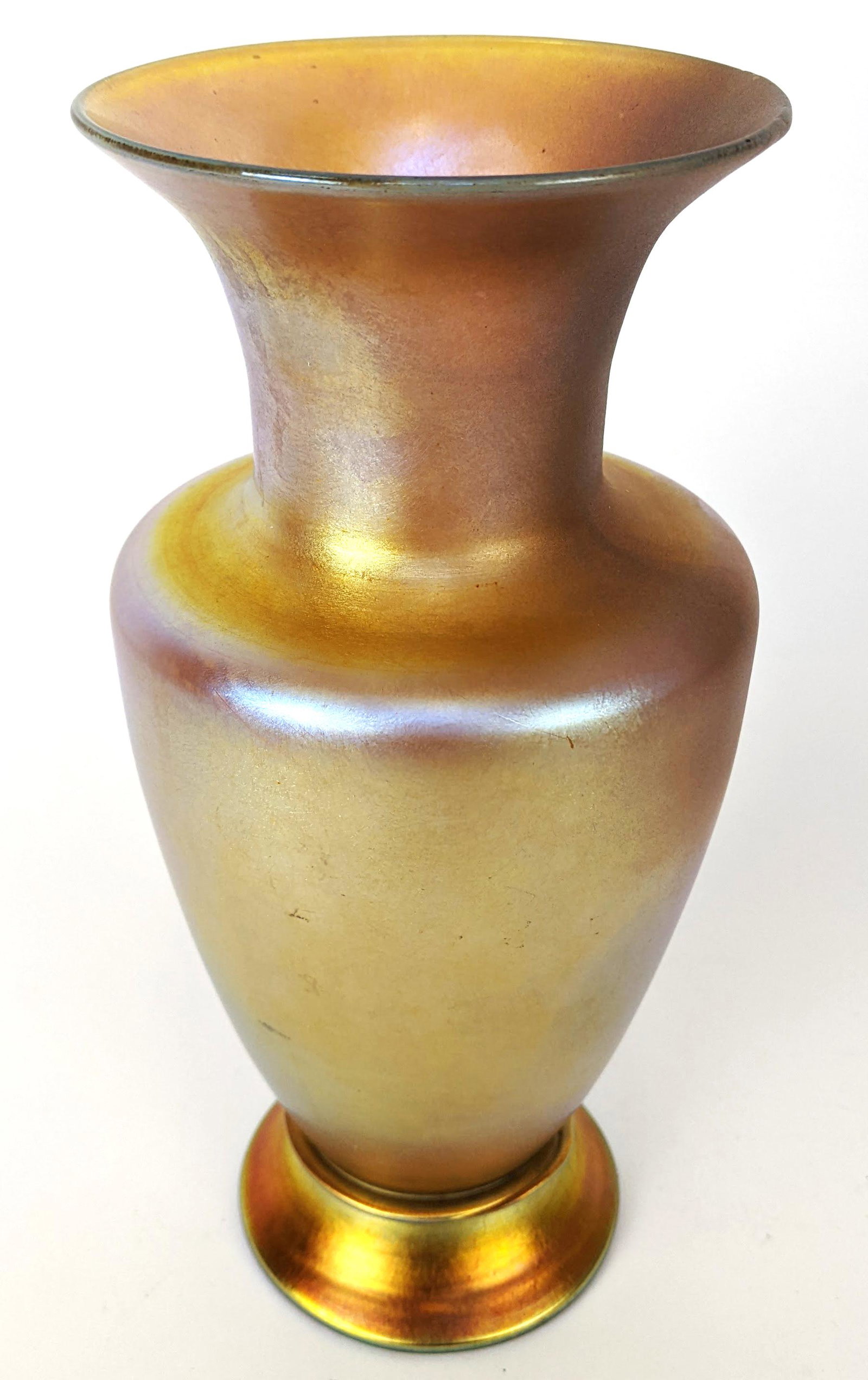 Tiffany Favrile Glass Vase: Tiffany favrile glass vase, signed Louis Comfort Tiffany, NY305, 4305N 1555. From the Estate of June Hirsch Jones. [8 3/4" H x 4" Diam.]. In good condition.
