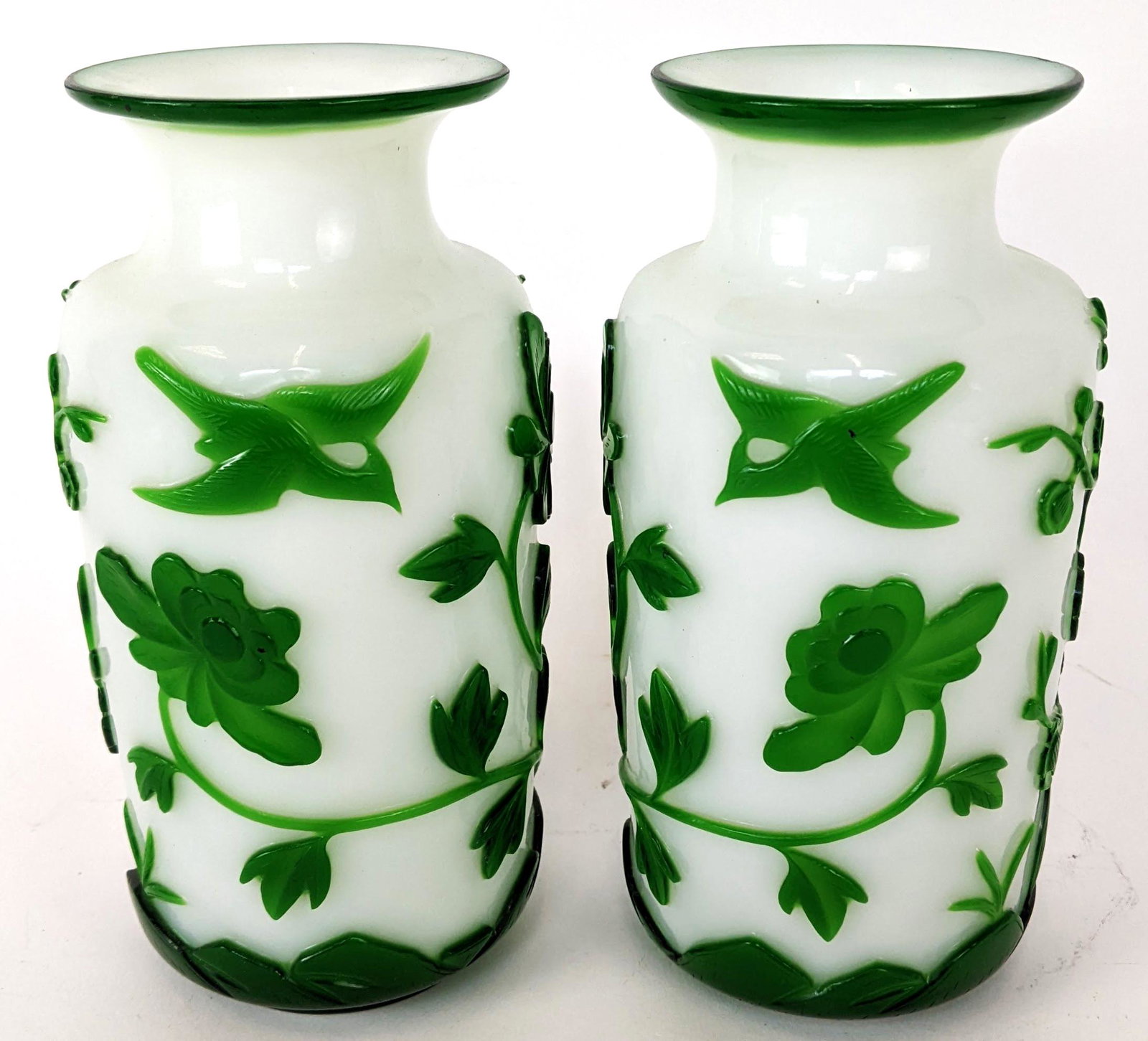 Pair of Green Peking Vases: Pair of green overlaid on white Peking vases, decorated with birds and flowers. From the Estate of June Hirsch Jones. [7 1/2" H x 3 3/4" Diam.]. In good condition.