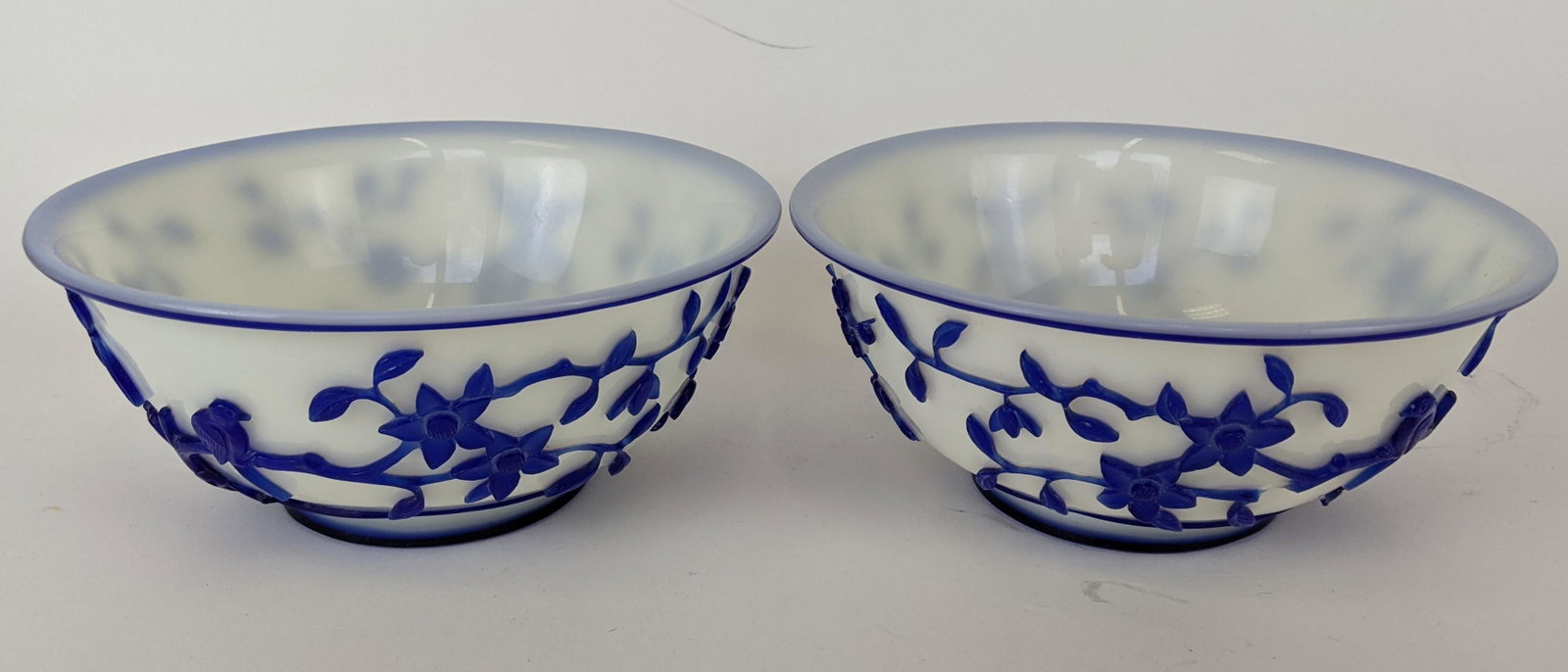 Pair of Blue Peking Bowls: Pair of blue on white 19th century Peking bowls. Purchased at Rare Arts, with original label. From the Estate of June Hirsch Jones. [2 3/4" H x 6 1/5" Diam.]. In good condition.