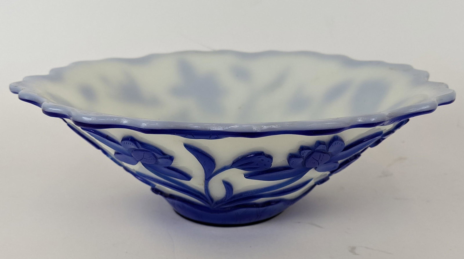 Peking Glass Blue Bowl: Peking glass blue on white bowl, flowers and birds. From the Estate of June Hirsch Jones. [3 1/4" H x 9" Diam.]. In good condition.