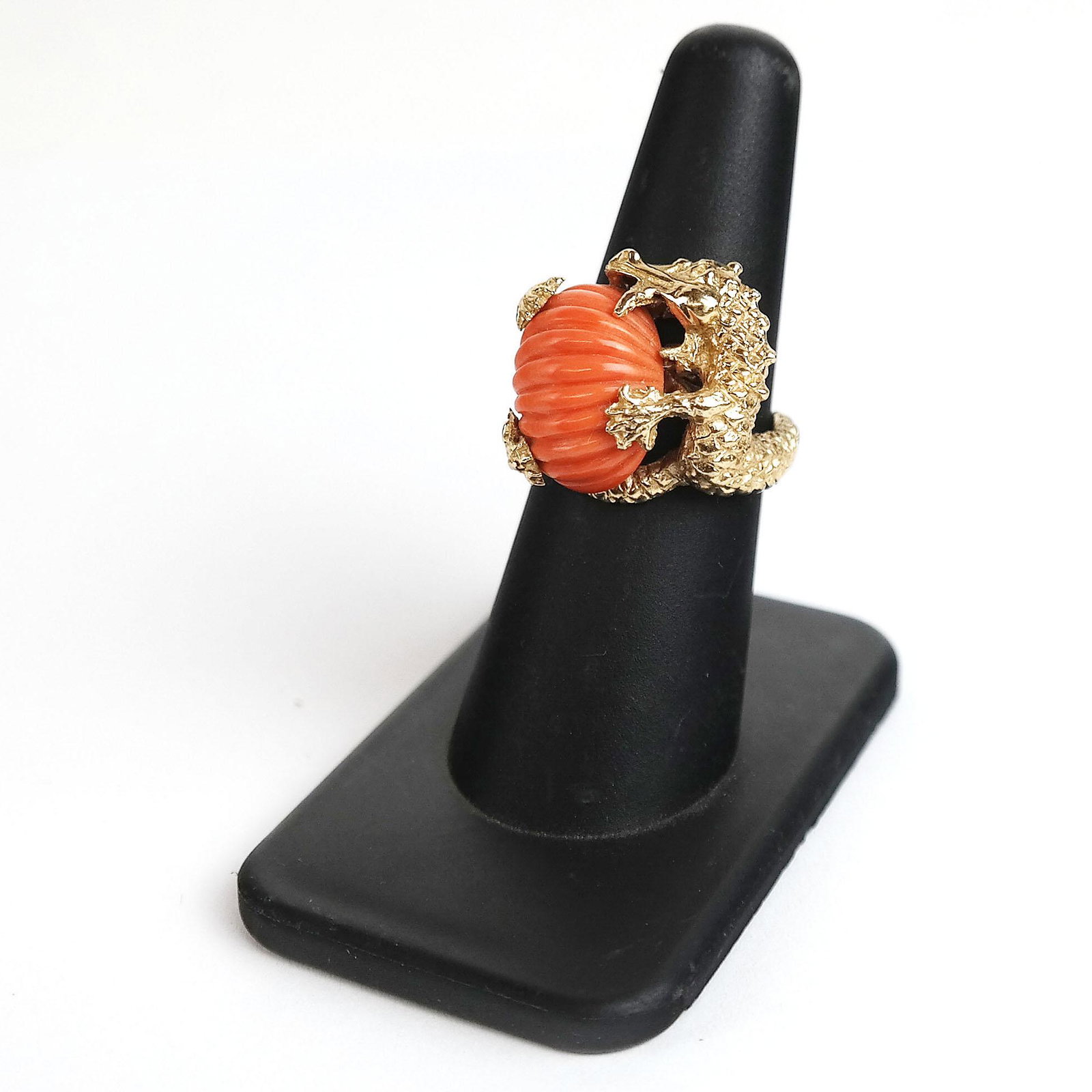 14K Yellow Gold Chased Alligator Ring: 14K yellow gold ring, designed as an alligator holding a carved coral snail. 7.9 dwt. inclusive. Size 6 1/2. In good condition.