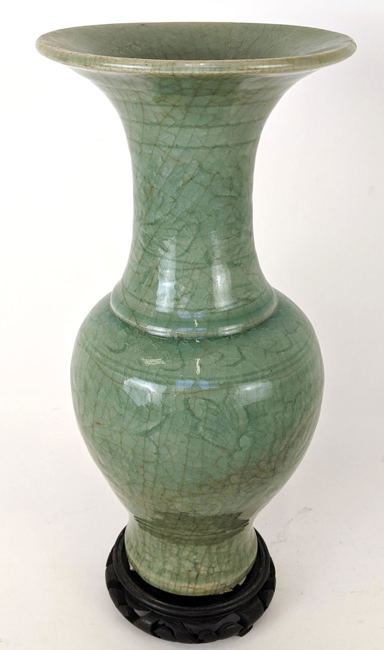 Antique Celadon Vase: Tall antique celadon vase, drilled through bottom, on a base.From the Estate of June Hirsch Jones. From the Estate of June Hirsch Jones. [Vase: 12 1/2" H x 5 1/2" D]. In good condition.