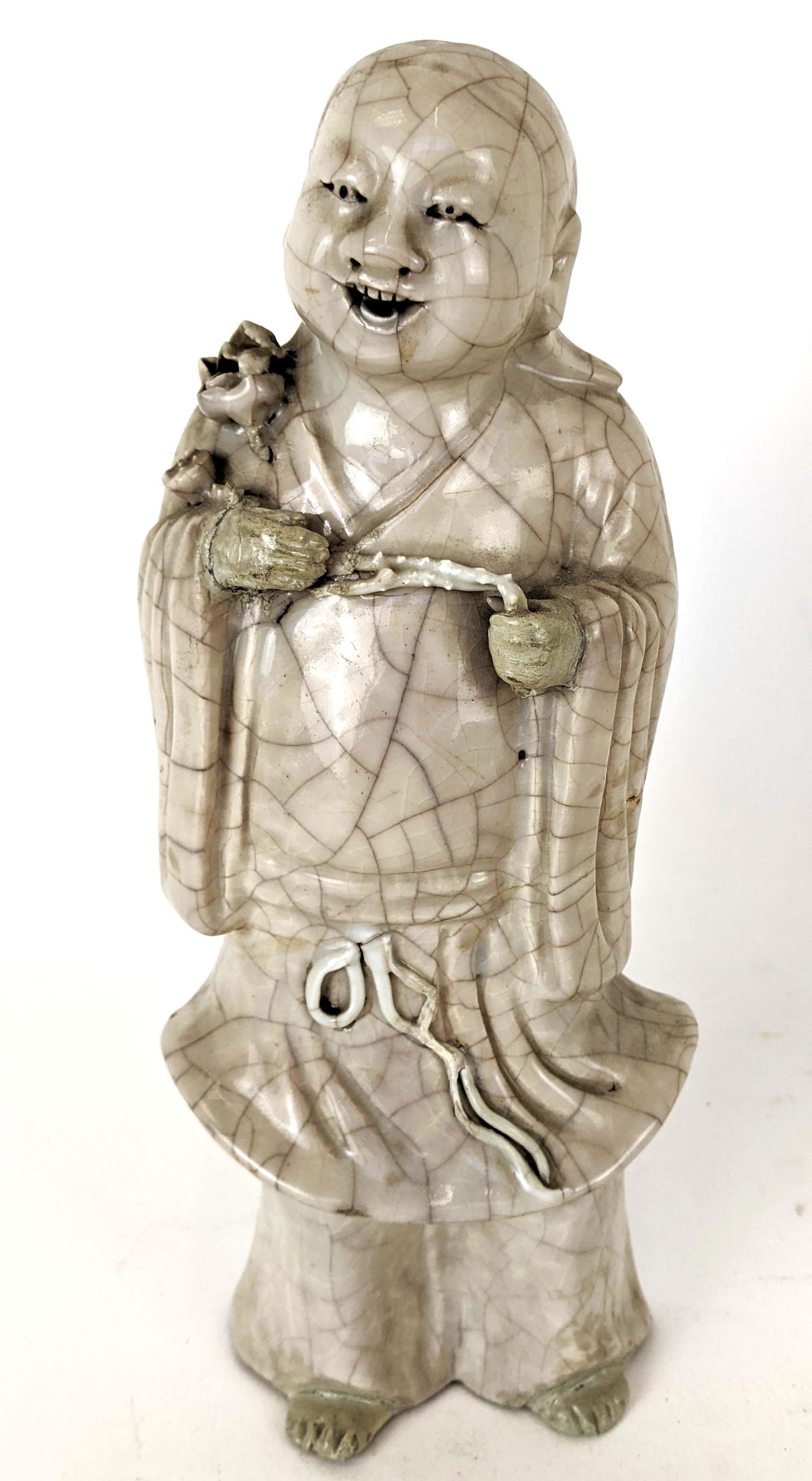 Antique Celadon Buddha: Late 19th century antique celadon Buddha. From the Estate of June Hirsch Jones. [9" H x 4" W x 2 1/2" D]. Repair on hand.