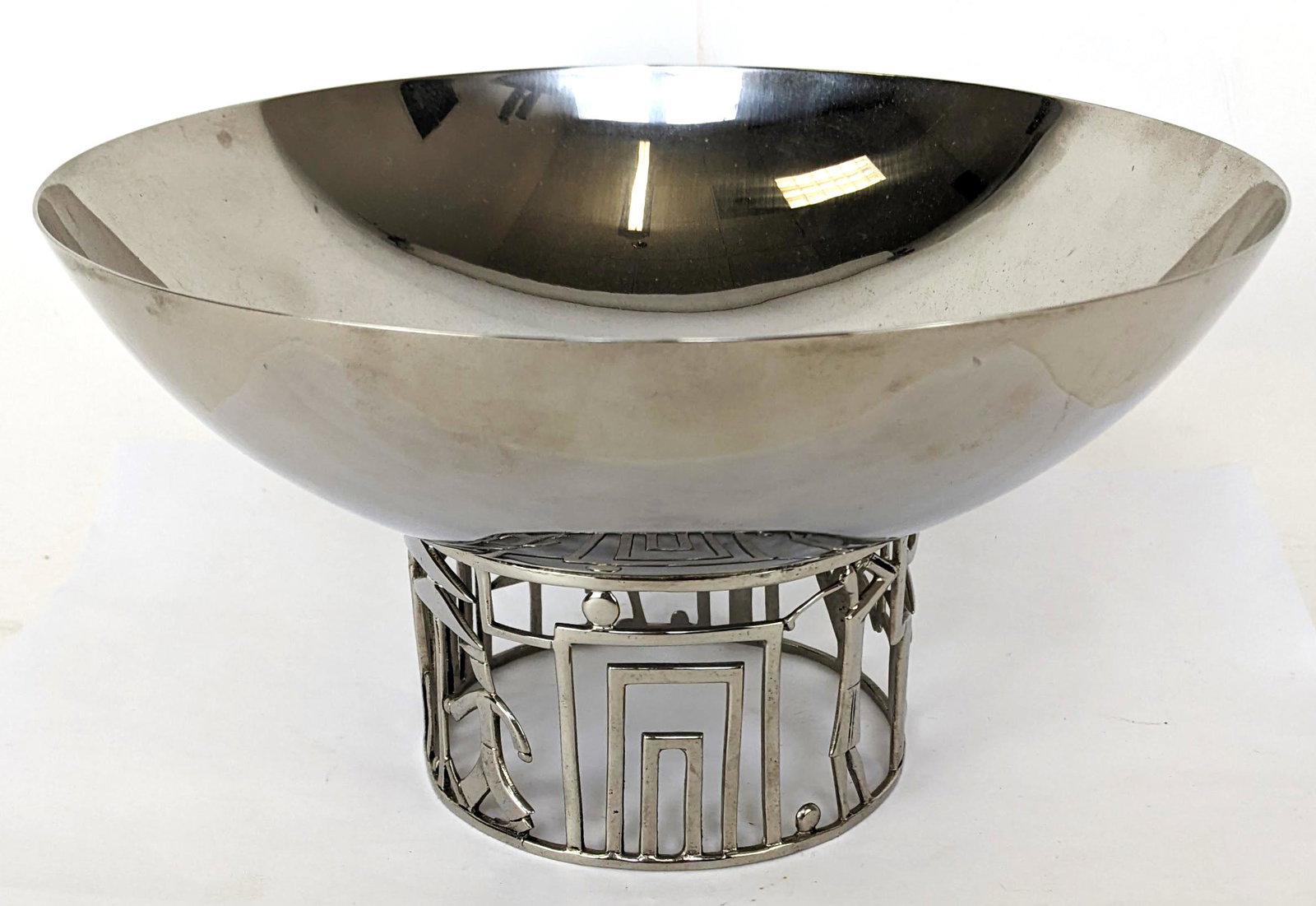Karl Hagenauer Nickel Plated Footed Bowl: Art Deco nickel-plated brass fruit bowl with golfing scene forming the base, by Hagenauer, Austria, circa 1930. Comes with receipt from James Infante, Jersey City, NJ. From the Estate of June Hirsch J
