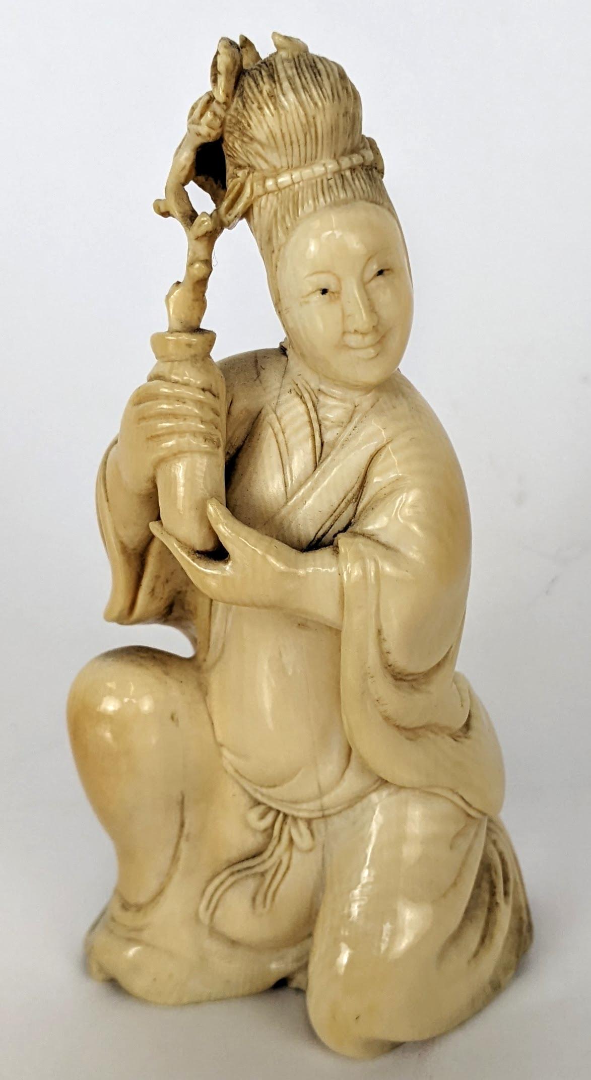 Chinese Carved Bone Kneeling Female Figure: Chinese carved bone kneeling female figure, holding a vase of flowers. Purchased from Rare Arts. From the Estate of June Hirsch Jones. [4" H]. In good condition.
