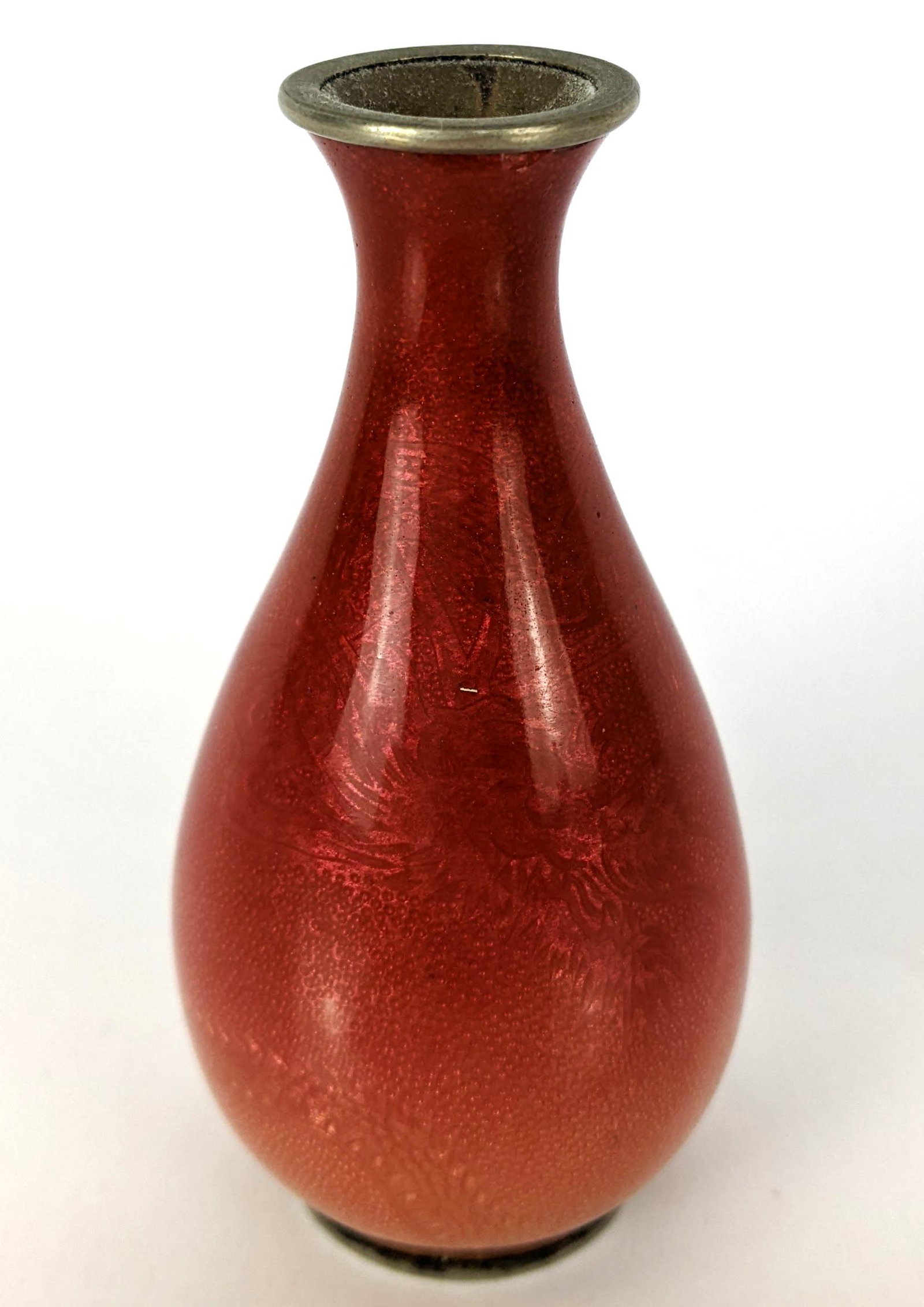 Japanese Cloisonne Enamel Vase: Japanese cloisonne enamel vase, silver with reddish pink color, decorated with dragon. From the Estate of June Hirsch Jones. [3 3/4" H x 1 3/4" D]. In good condition.