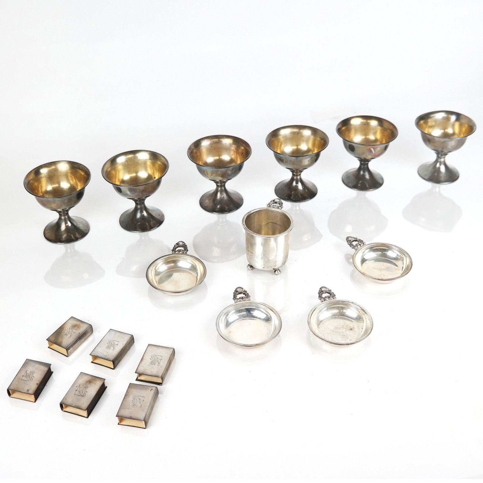 Assorted Sterling Silver Articles: Assorted sterling silver articles, including set of six cups, set of four wine tasters, and more. 19.385 ozt. total. From the Estate of Florence and Herbert Irving. In good condition.