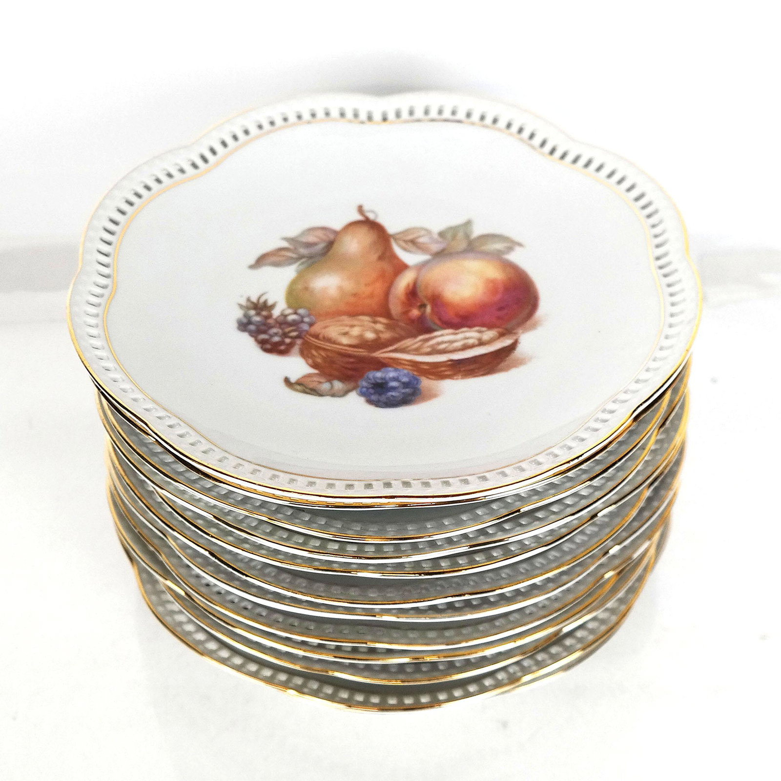 Set of 12 Bavarian Fruit Plates: Set of 12 Bavarian fruit plates, with open rims, by Schumann. Provenance: Estate of Florence & Herbert Irving. [8" Diam.]. In good condition.