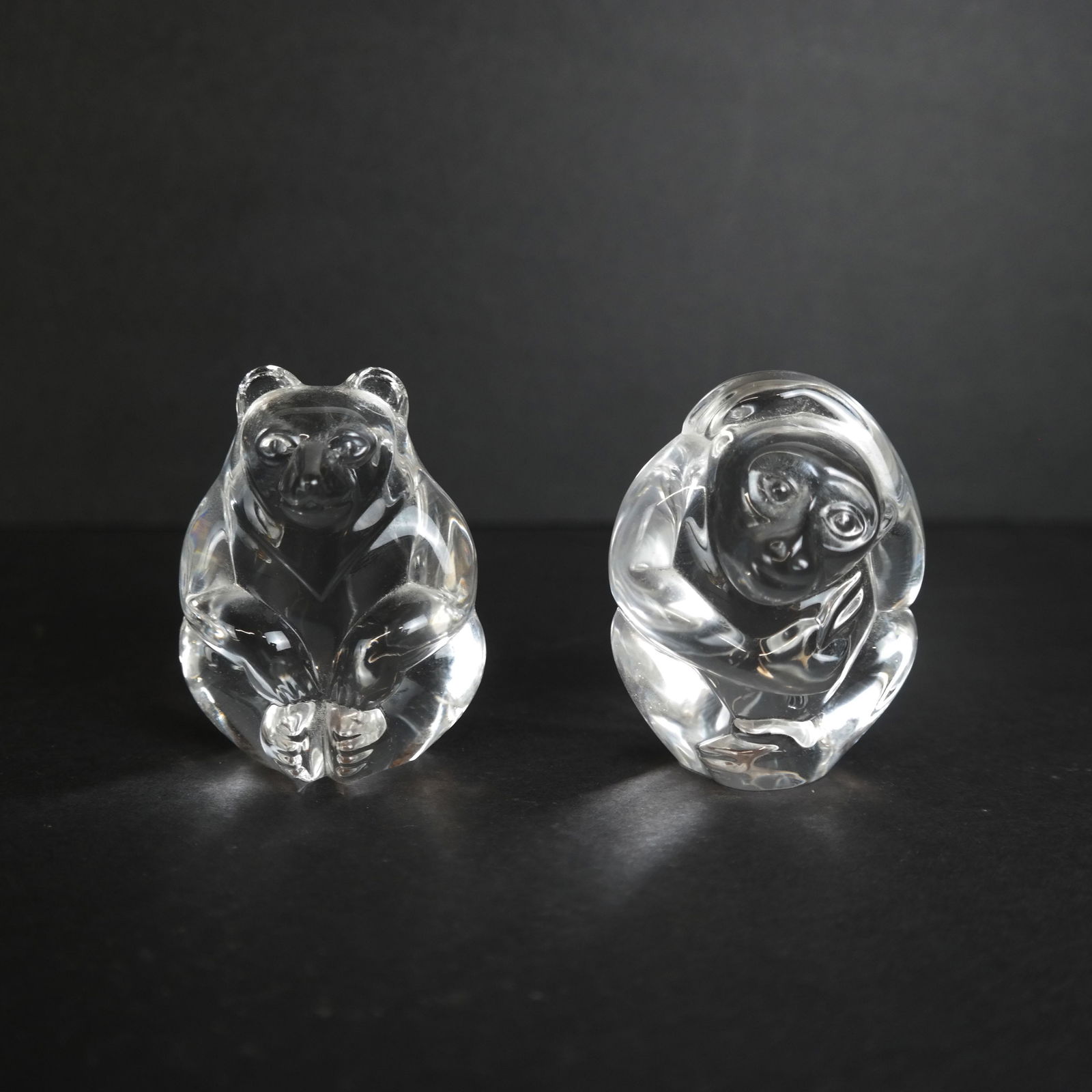Two Steuben Hand Warmers: Two Steuben hand warmers, in monkey and bear forms. [3" H]. In good condition. From the Estate of Florence and Herbert Irving.
