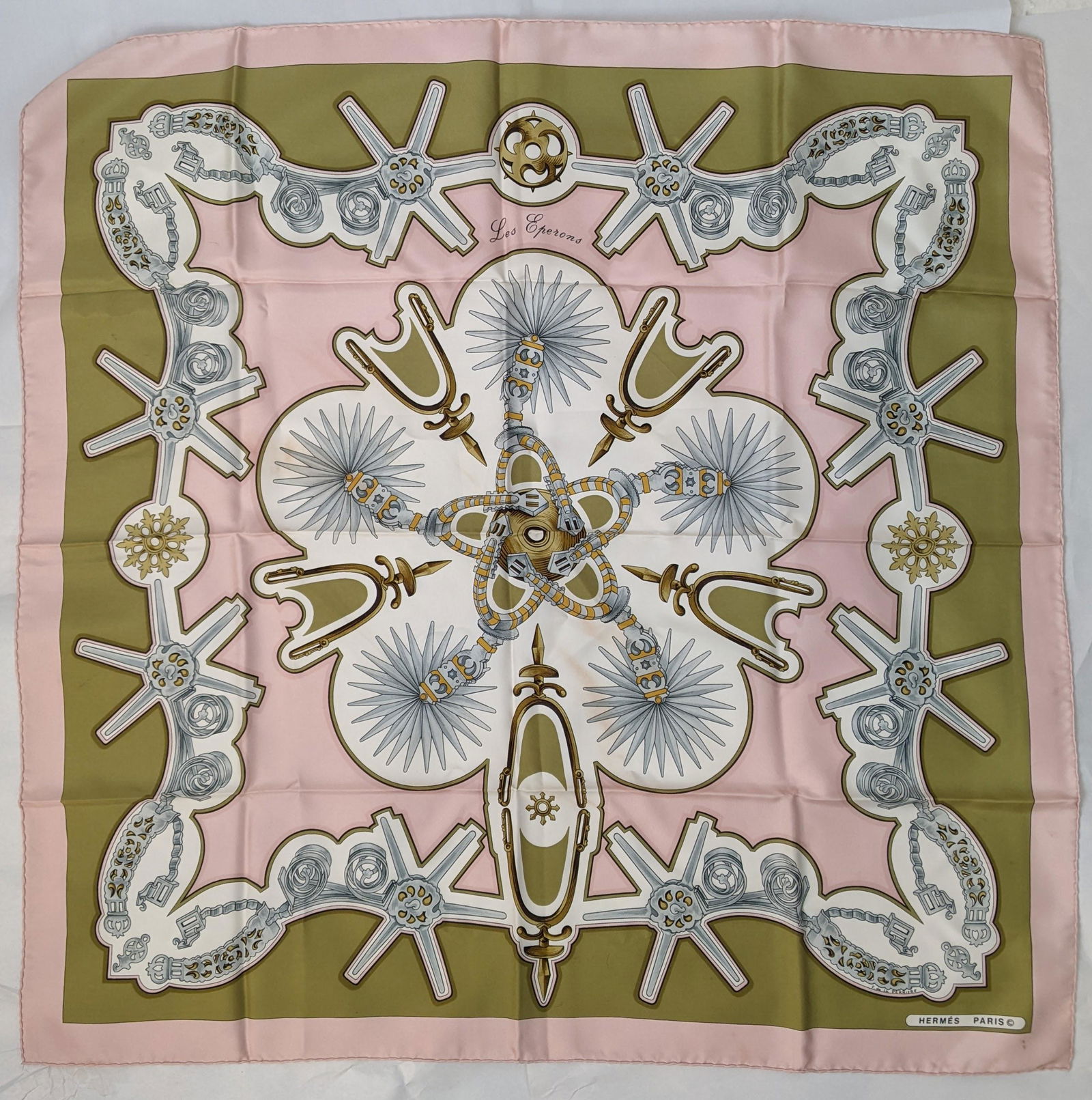 Hermes 100% Silk Scarf "Les Esperons": Hermes 100% silk scarf, "Les Esperons". From the Estate of Florence and Herbert Irving. [Approx. 35" x 35"]. In good condition.