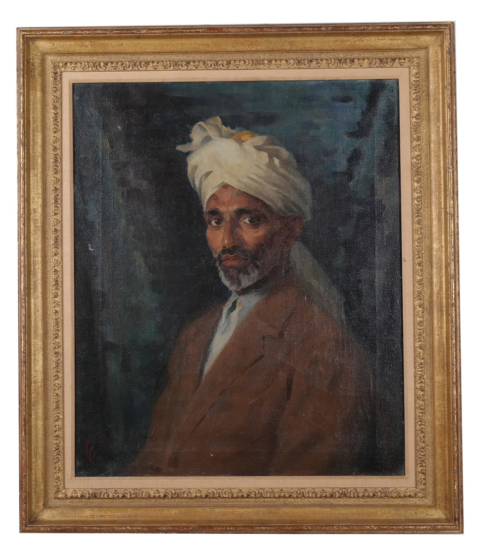 Portrait of an Indian Man: Early 20th century oil on canvas portrait of Indian man in a later gilt wood frame. Monogrammed lower left D.E. Vicai (?). Stamped "Newman Soho Square London" on back. Previously owned by Ann M. Antol