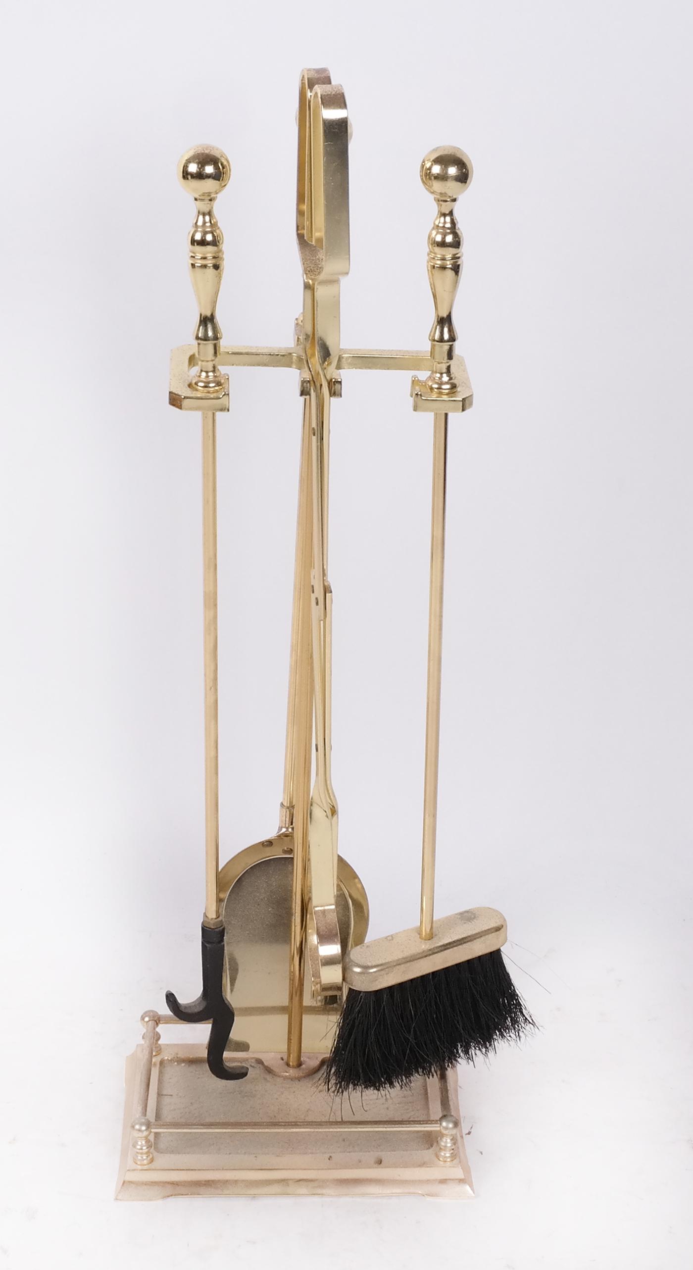 Fire Tools on Stand: Fire tools on stand, brass plated. From the Estate of June Hirsch Jones. [30" H]. In good condition.