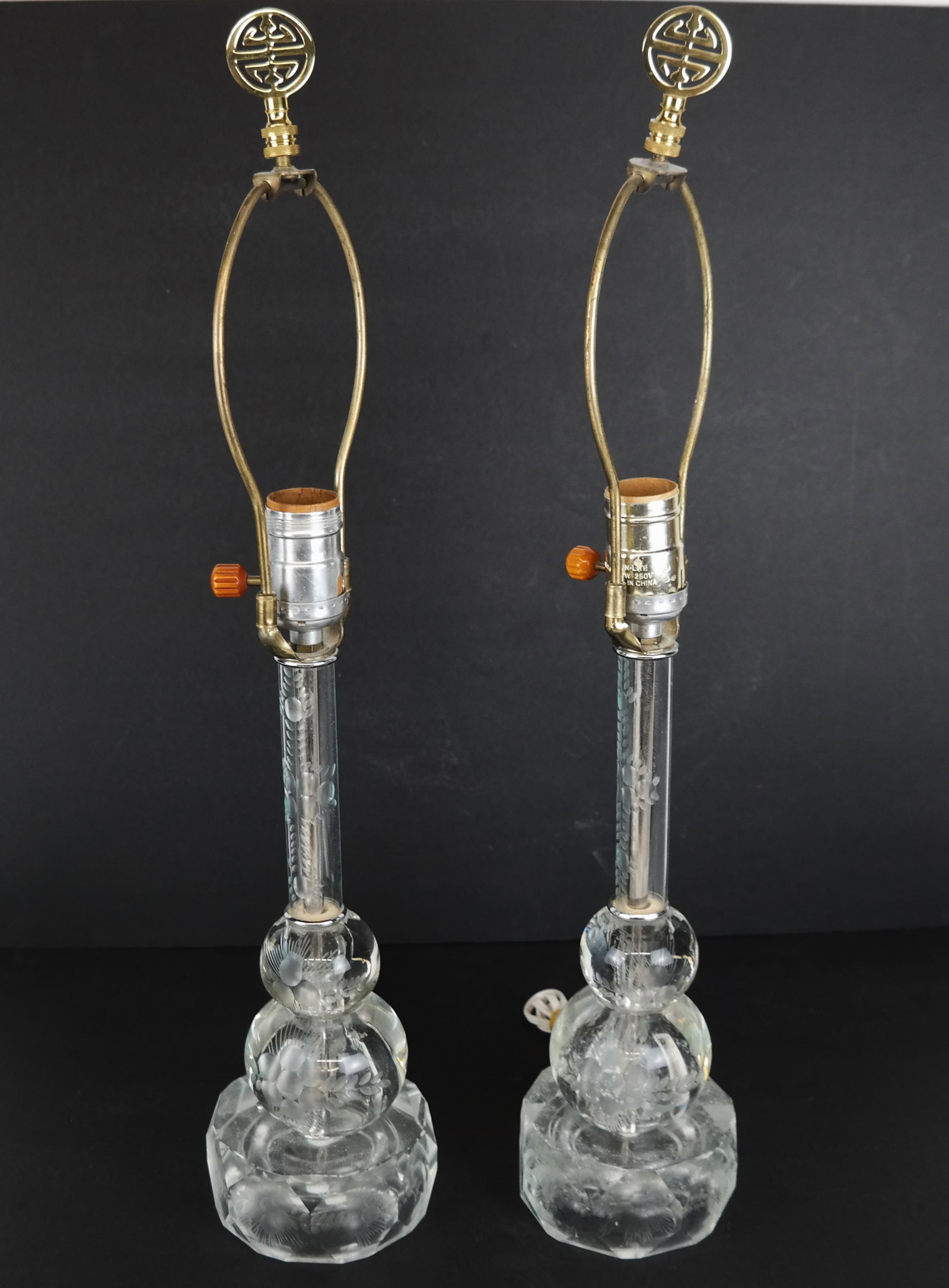 Pair of Modern Crystal Etched Lamps: Pair of modern crystal etched lamps. Provenance: Estate of Florence and Herbert Irving. [14" H x 4" Diam. bases]. No cords.