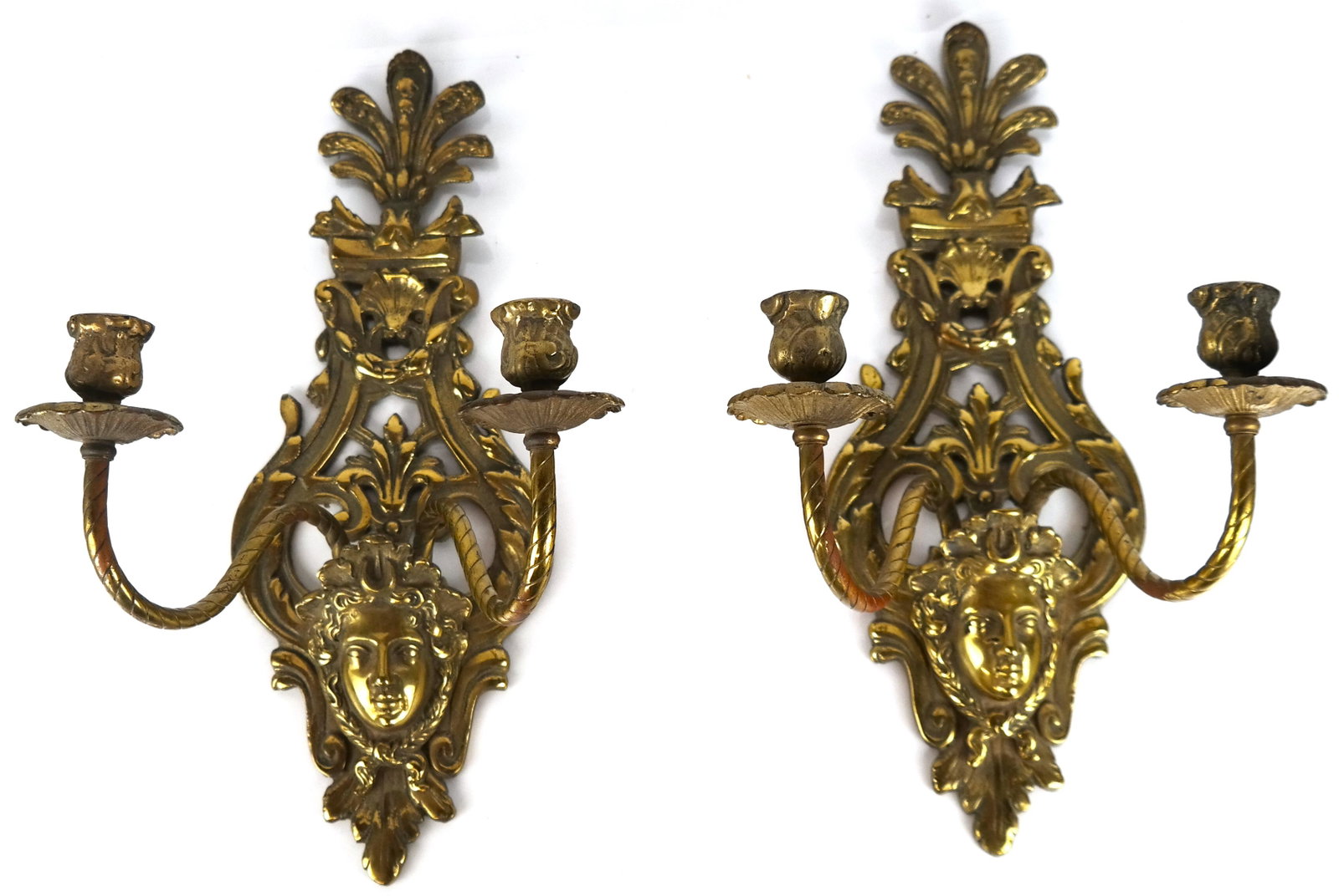 Pair of Classical-Style Two Light Sconces: Pair of classical-style two light sconces, with faces of women design. Provenance: Estate of Florence and Herbert Irving. [16" H x 9" W x 8" D].