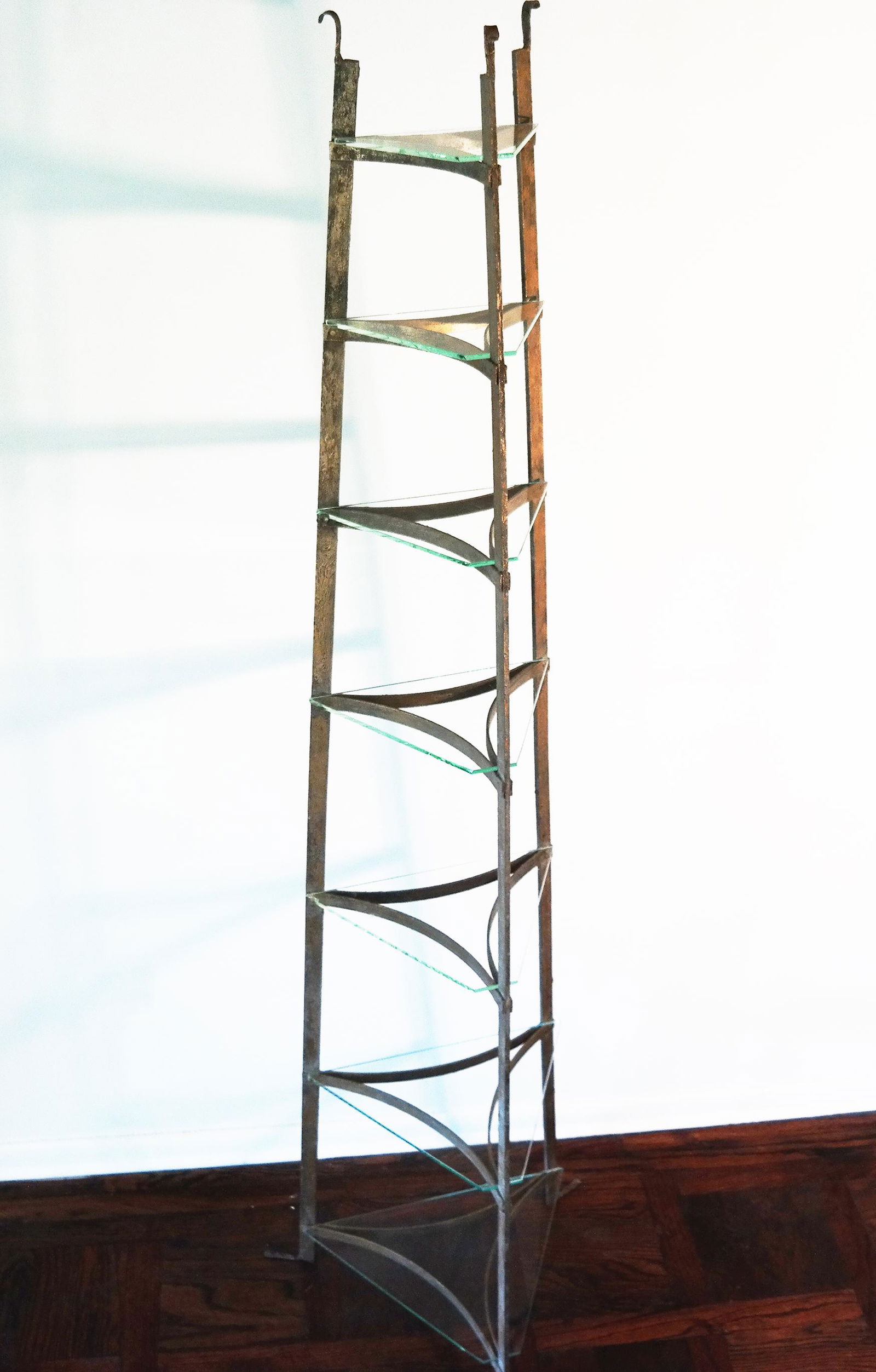 Modern Obelisk Design Etagere: Seven tier bronze, tapered form etagere with glass shelves. Provenance: Estate of Florence and Herbert Irving. [74 1/2" H x 22" Diam. base].