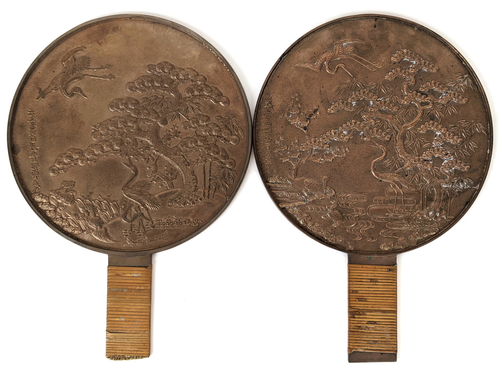 Pair of Japanese Bronze Mirrors: Pair of Japanese bronze relief mirrors. Provenance: Estate of Florence and Herbert Irving. [13" H x 9" Diam.].