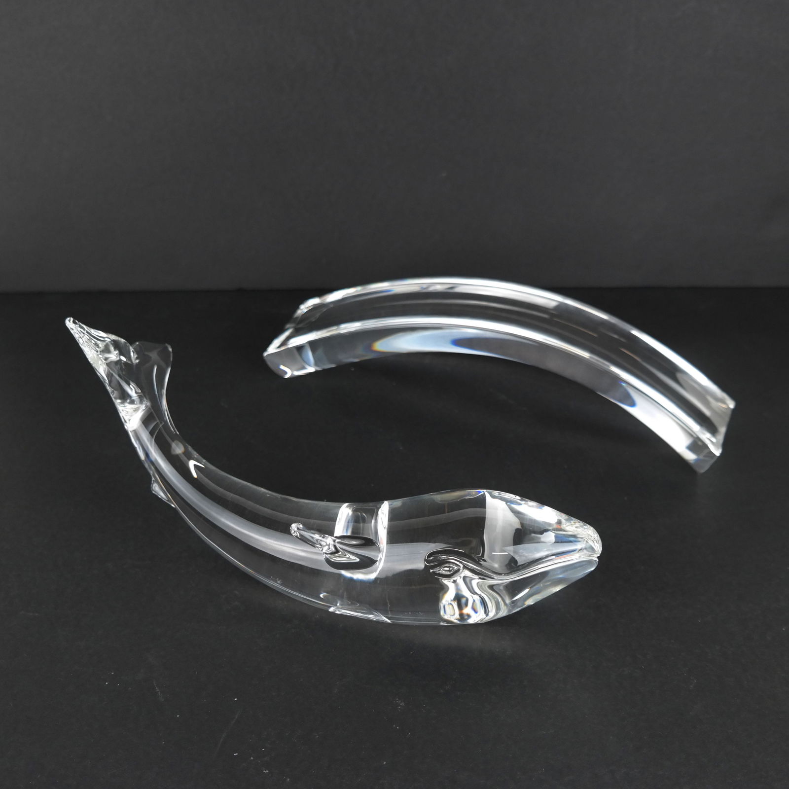 Steuben Crystal Whale: Steuben crystal whale, on a black dedication base. [3" H x 10" Diam.].