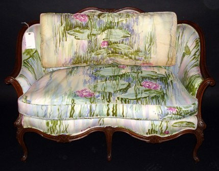 Louis XV Style Settee: A walnut country style upholstered settee having a carved crest. Good condition. 33.5" H x 49.5" L x 31" D