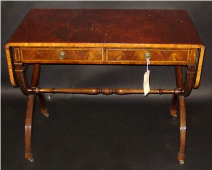 Tibbenham, England Sofa Table: Regency style mahogany two drawer sofa table having drop sides and a satin inlaid border and cross stretcher.