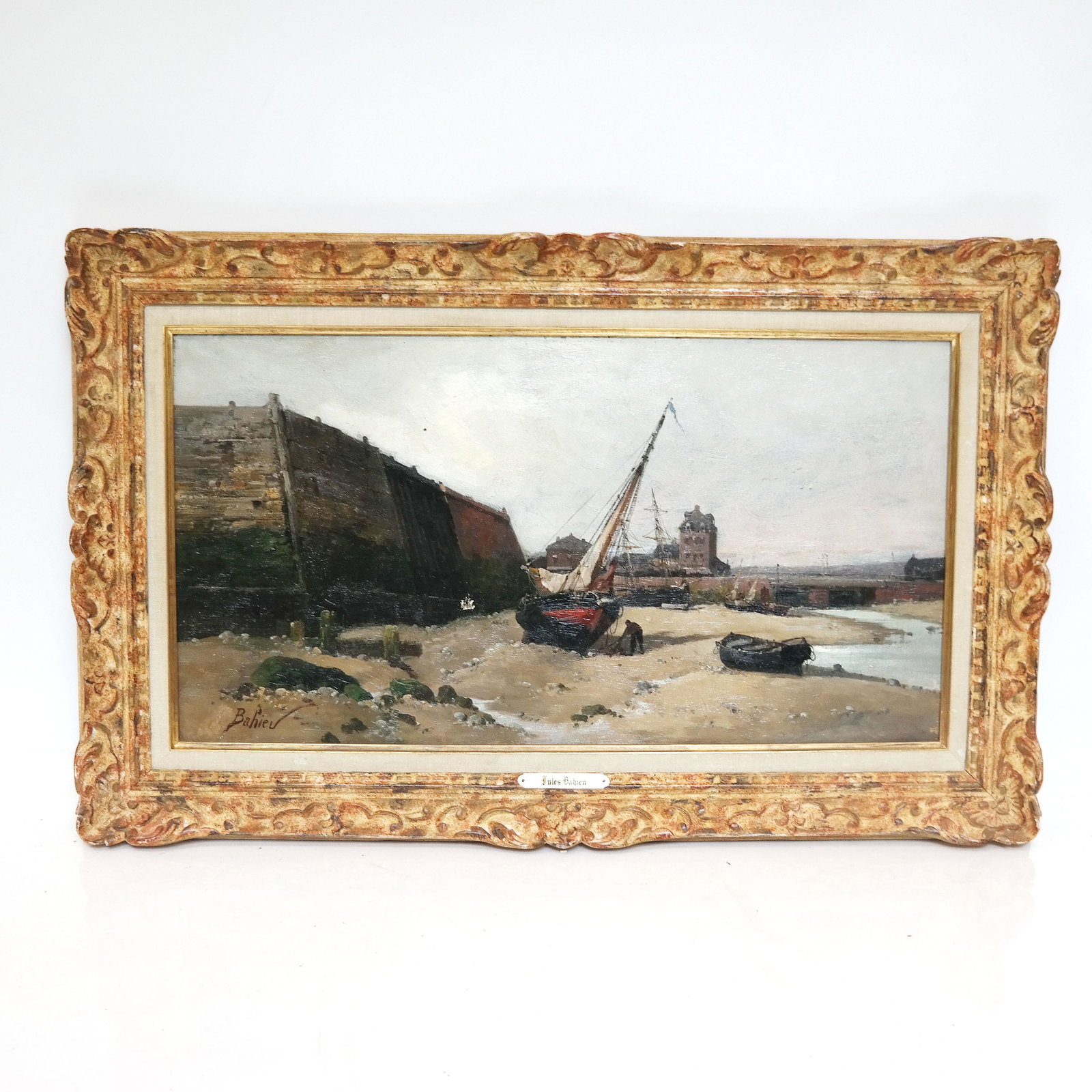 Jules BAHIEU: Oil on Canvas - Shore Scene: Jules Bahieu (Belgian, 1860-1895) shore scene with buildings and boats ashore, signed lower left. [Art: 13" H x 25" W; Frame: 20" H x 32" W]. Hole in canvas.