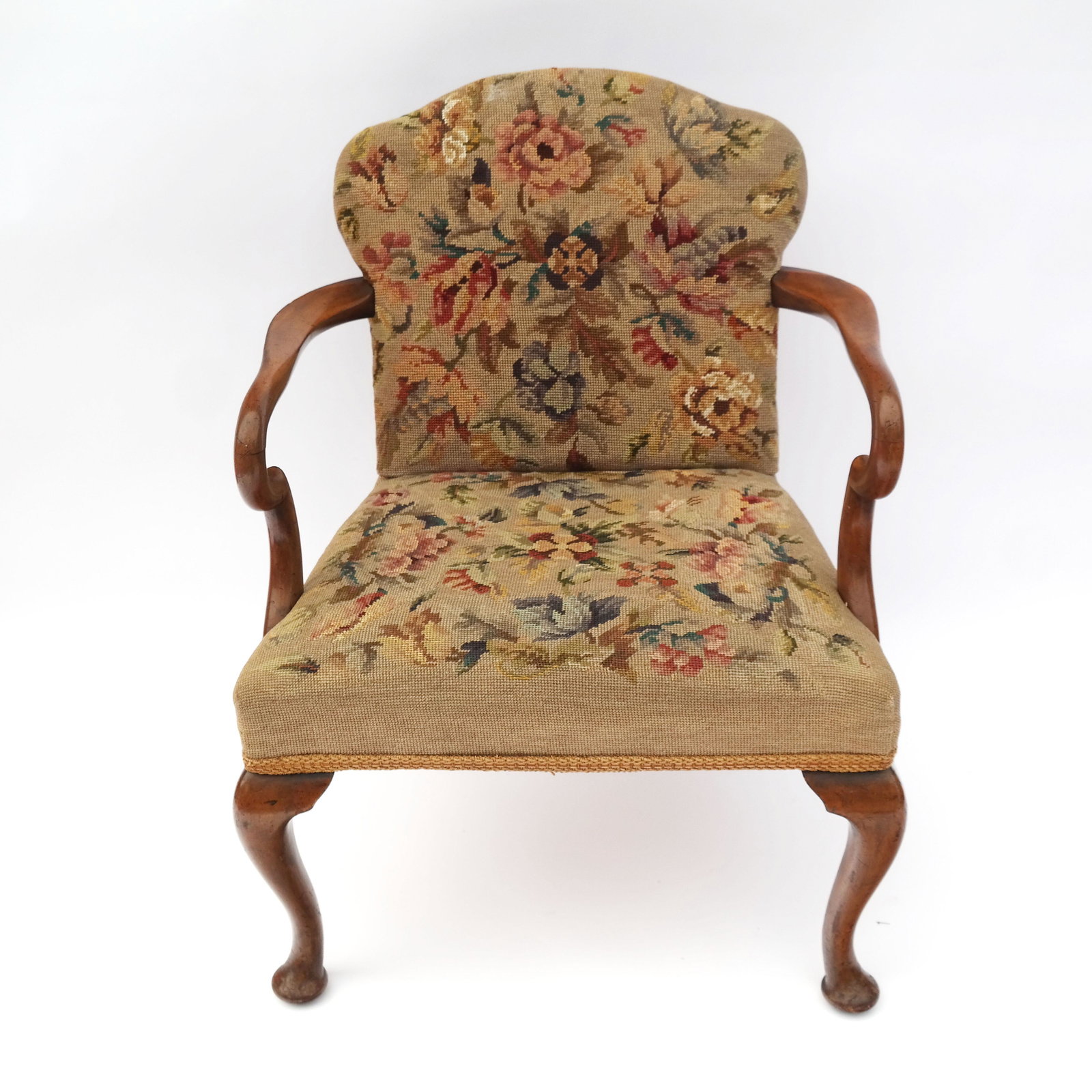Queen Anne-Style Walnut Arm Chair: Late 19th century Queen Anne-style walnut arm chair with antique tapestry upholstery. [31 1/2" H x 23 1/2" W x 20" D].