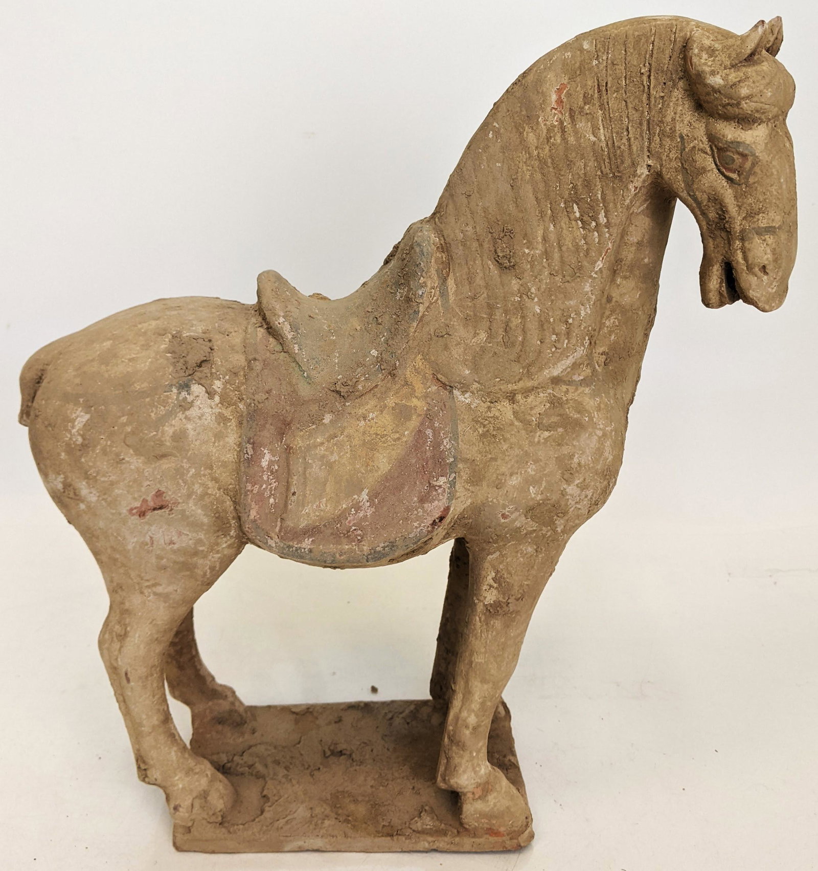 Asian Tang Horse: Antique terracotta Asian Tang horse. From the Estate of June Hirsch Jones. [14 1/4" H x 12" W x 4" D]. In good condition.