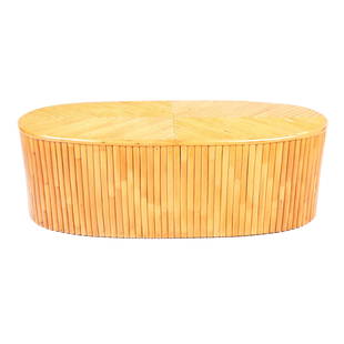 Paul Frankl-Style Oval Bamboo Table: Paul Frankl-style oval bamboo table, on casters. [16" H x 48" W x 18 1/2" D]. Scratches; wear.