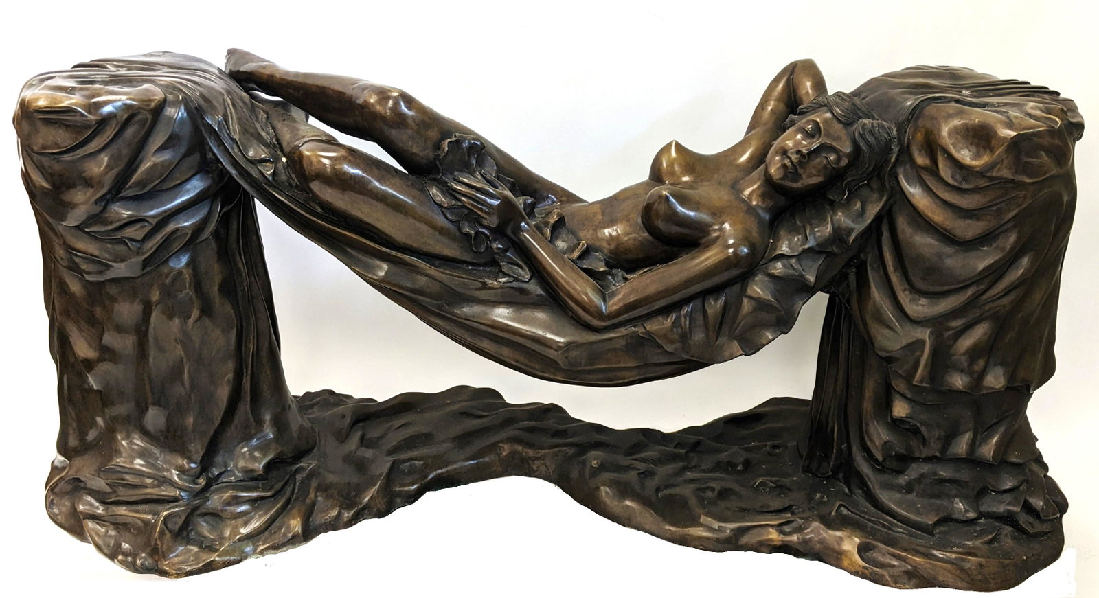 Reclining Nude Bronze Garden Sculpture: 20th century bronze garden sculpture of a reclining nude woman. [29" H x 68" W x 20" D]. Missing glass top. Four small holes in top corners.