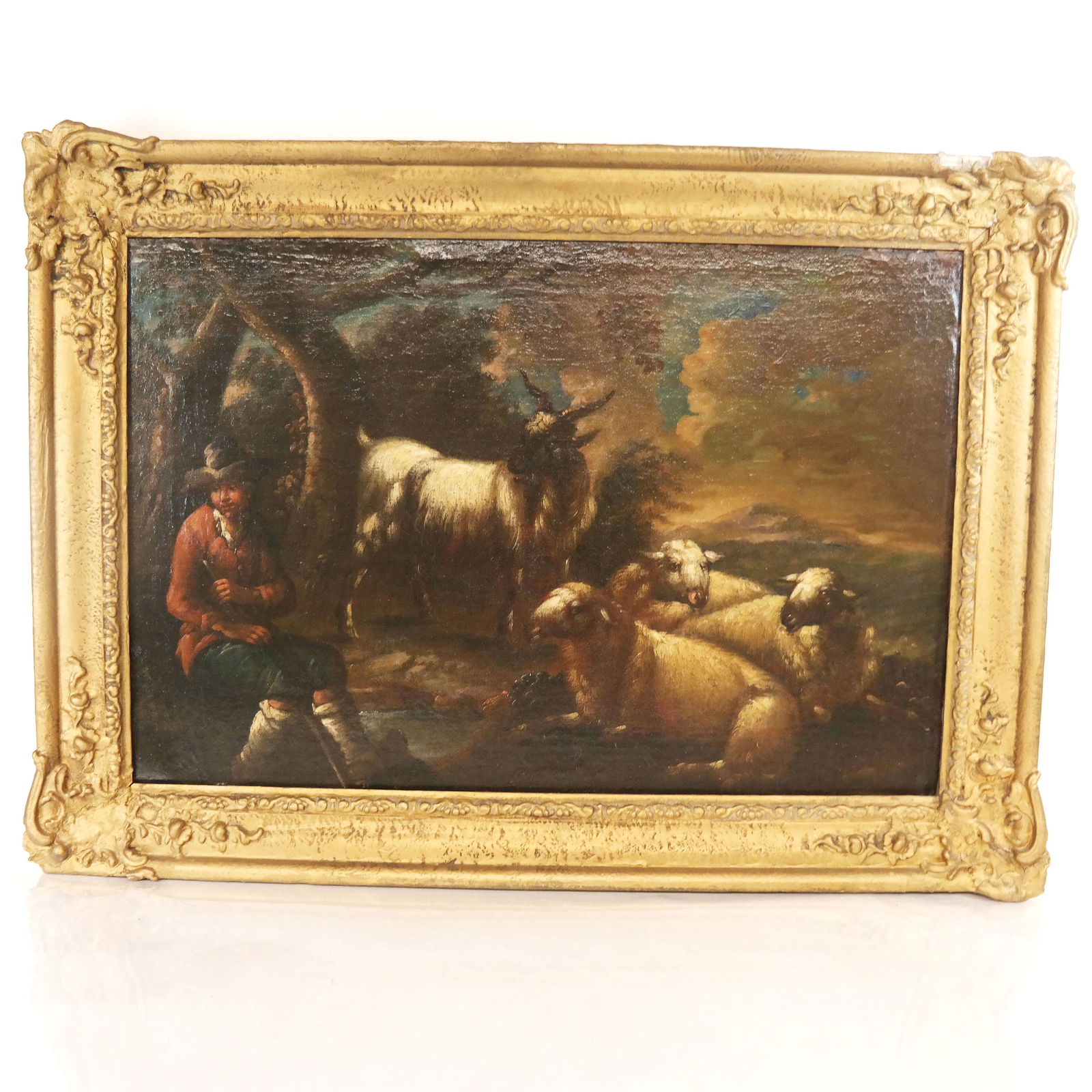 A Shepherd & His Flock - Oil Painting: Oil on canvas laid down to masonite (possibly) painting of a shepherd and his flock. [Art: 19" H x 29" W; Frame: 25 1/2" H x 35" W]. Restored.