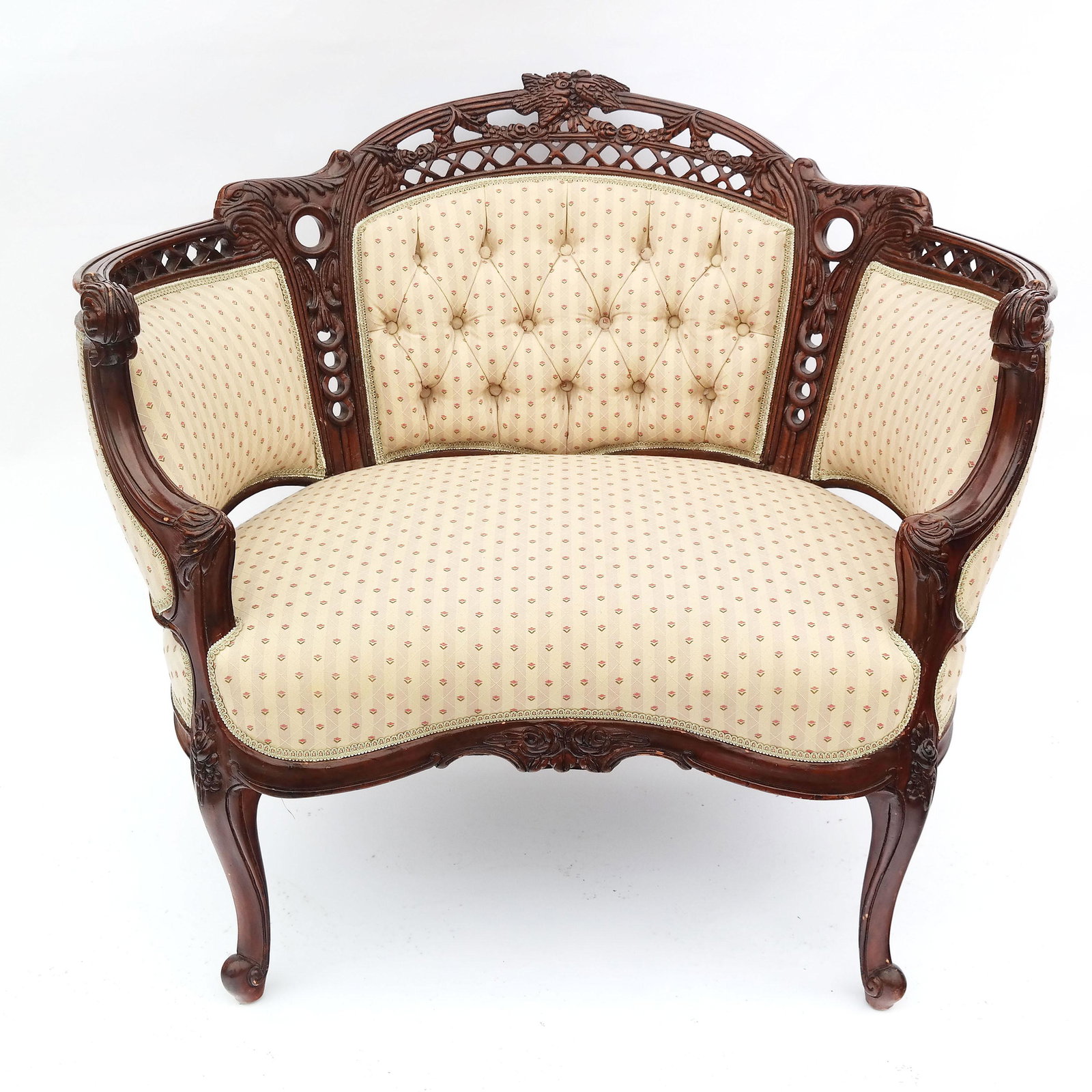Louis XV-Style Carved Bergere: Louis XV-style carved bergere with tufted upholstery. In good condition.