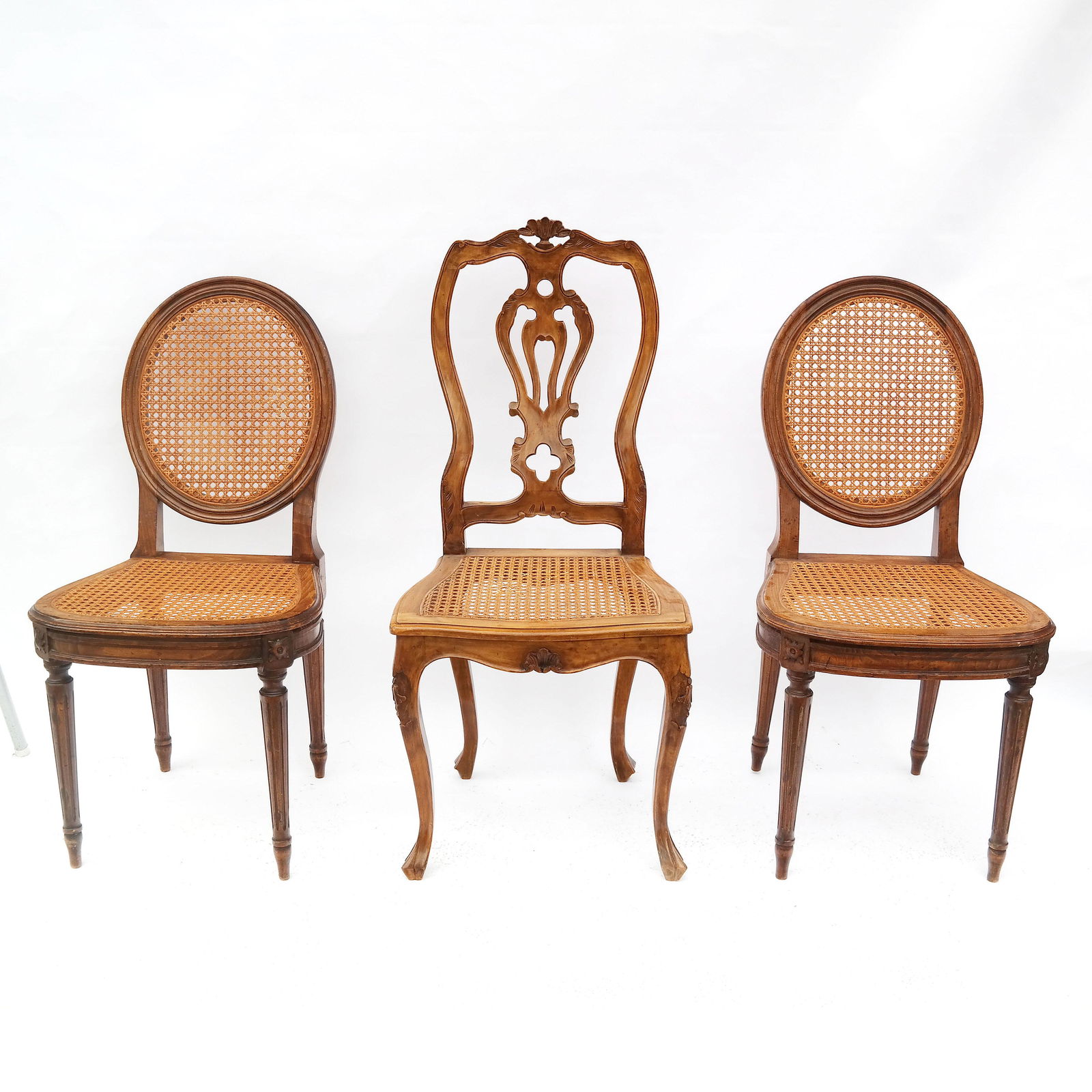 Three Provincial Caned Side Chairs: Three Provincial caned side chairs, including a pair of chairs and a single chair. [37 1/2" H x 19" W x 16 1/2" D (x2); 41 1/2" H x 18" W x 16 1/2" D]. In good condition.
