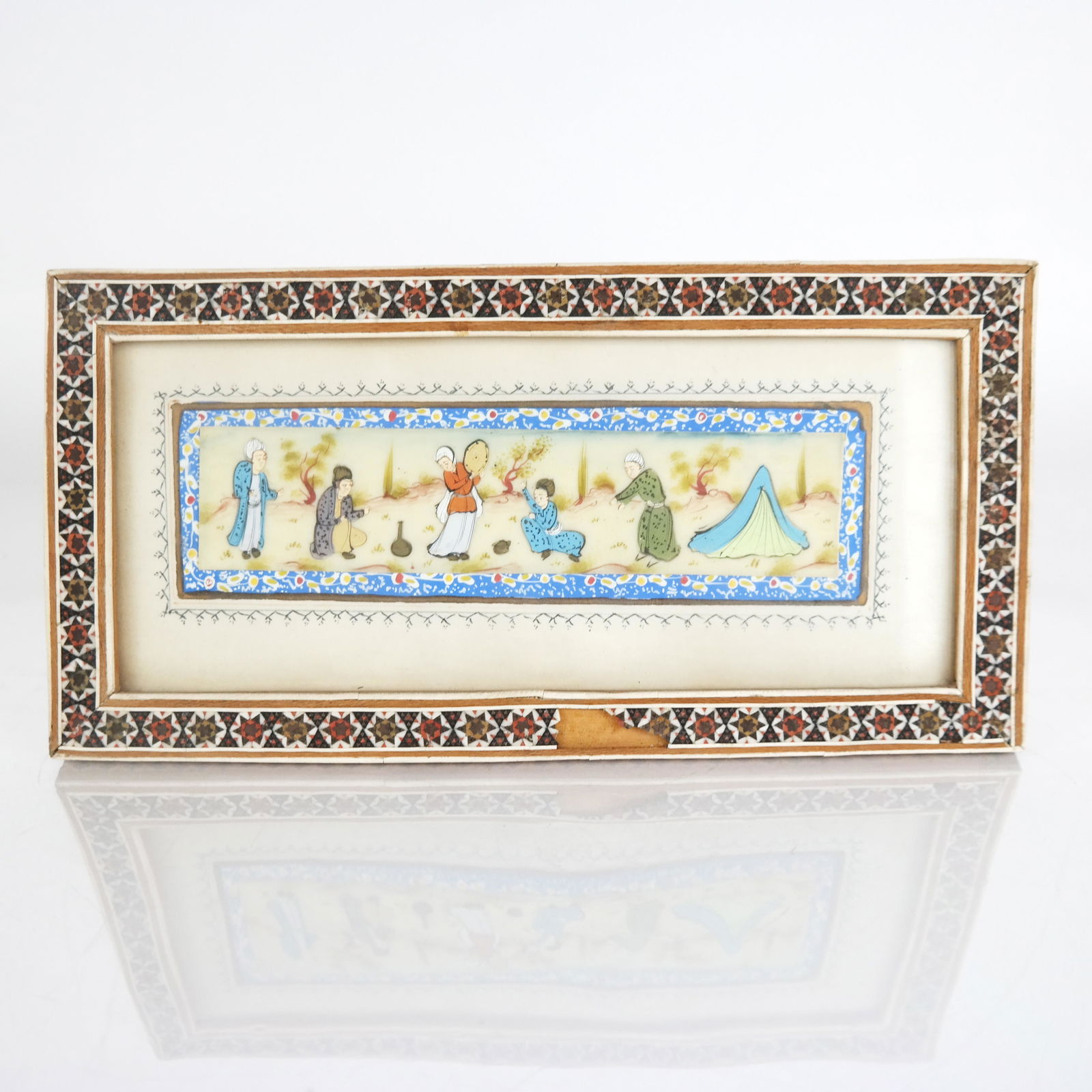 Antique Persian Painting on Bone Mughal: Antique Persian painting in bone inlaid micromosaic and hand painted frame. [Overall: 5" H x 10" W]. In good condition, frame missing pieces.