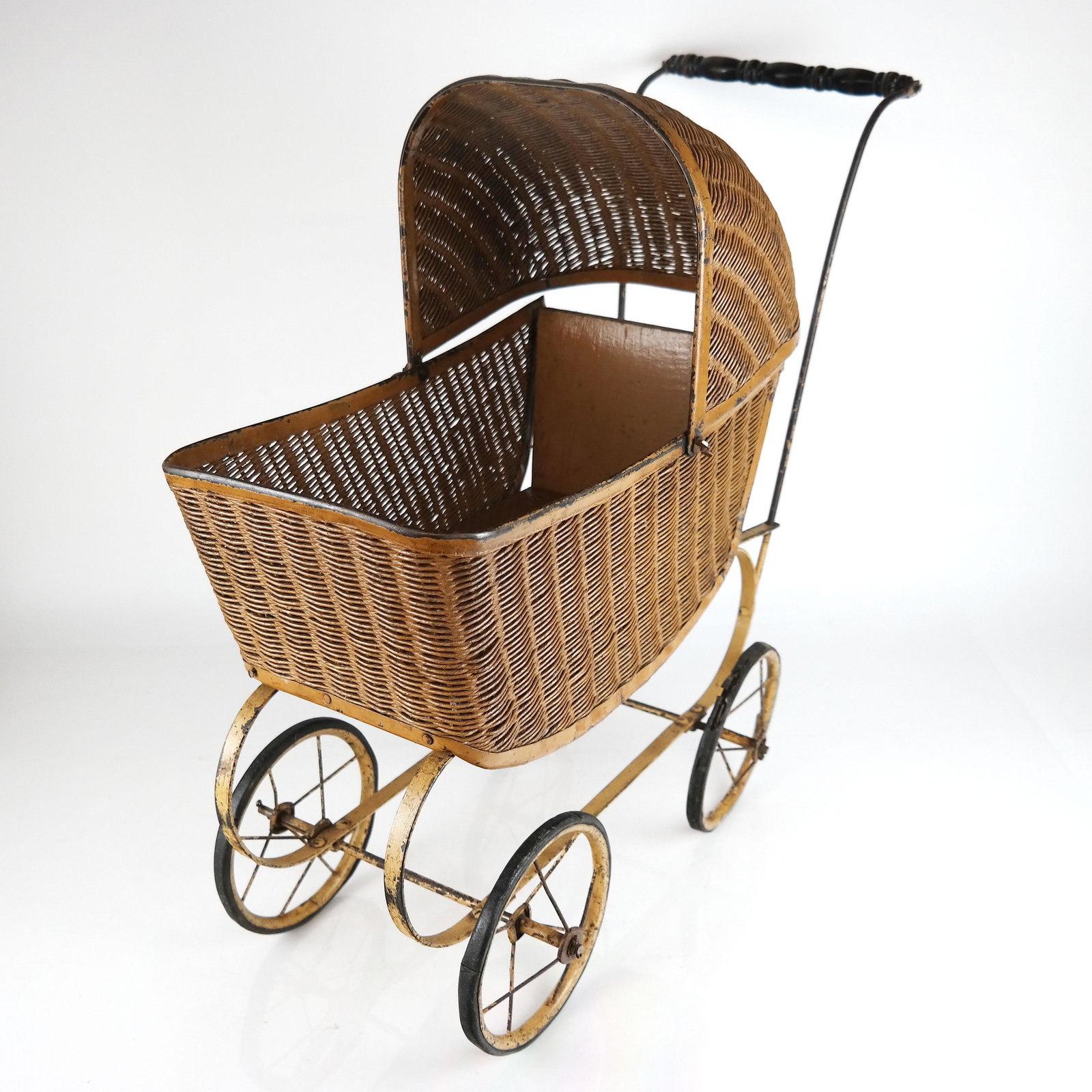 Vintage Perambulator - Baby Carriage: Wicker and wood carriage on metal frame with wood handle. [21" H x 26" W x 11" D].