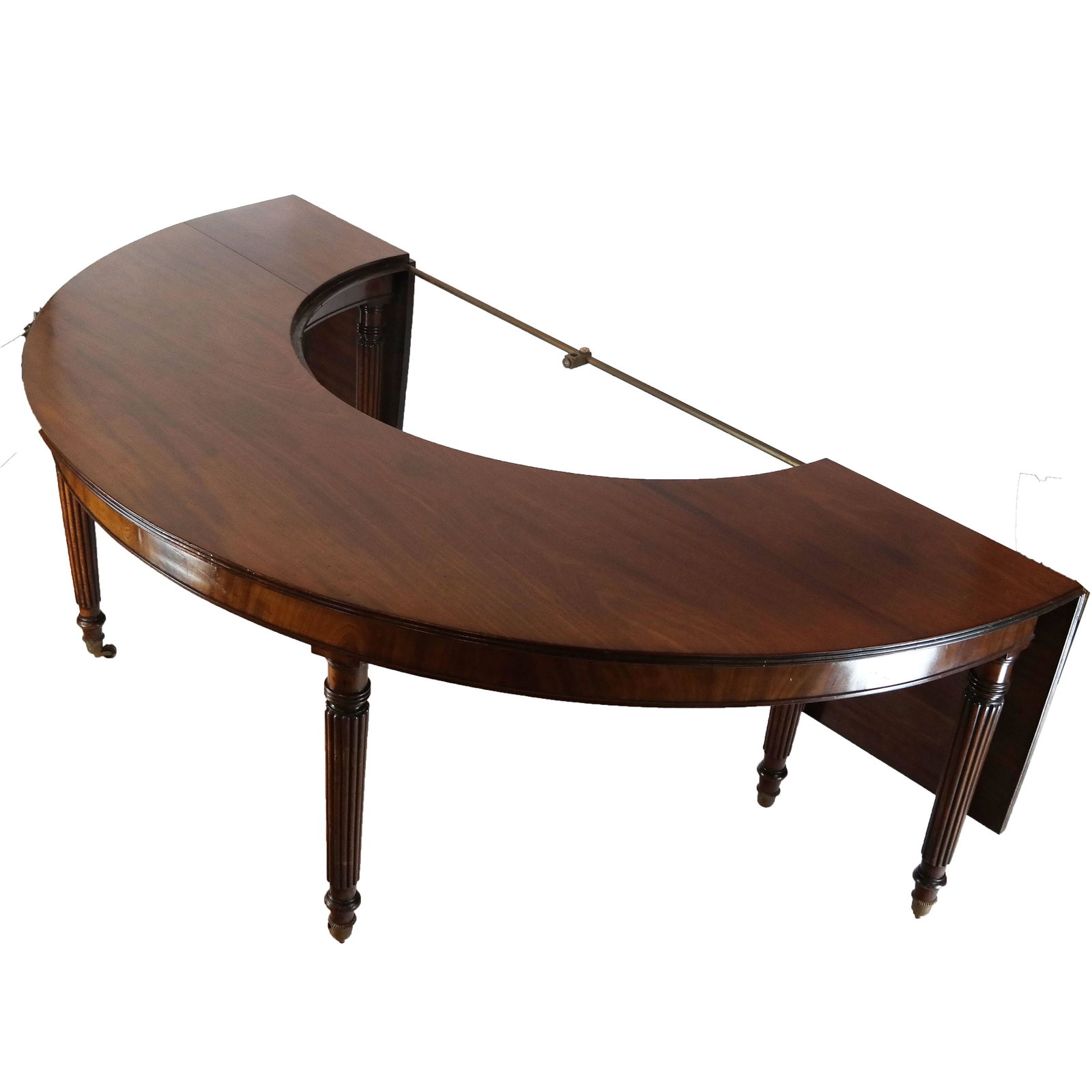 Regency Mahogany Wine, Hunt or Social Table: Regency mahogany wine, hunt or social table, circa 1810, the demi-lune top, either end united by a brass rail, the rear edges with hinged flaps. Missing the center section. Provenance: Christie's, Lon