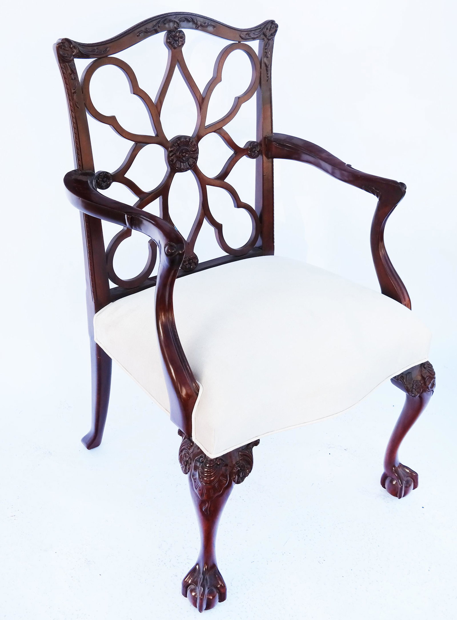 Chippendale-Style Mahogany Lattice Back Armchair: Late 20th century Chippendale-style carved mahogany lattice back armchair, with ivory colored seat. [39" H x 24" W x 20" D]. In good condition.