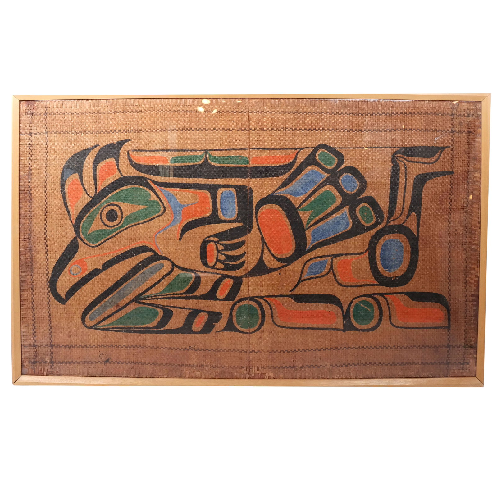 KOLUS: Bird Head - Painting on Straw: Painting of bird head on rattan / straw, Northwest Coast, British Columbia, by Kolus, younger bother of Thunderbird, bearing Douglas Ewing, NY Gallery label. [Art: 38" H x 64" W; Frame: 40" H x 66" W]