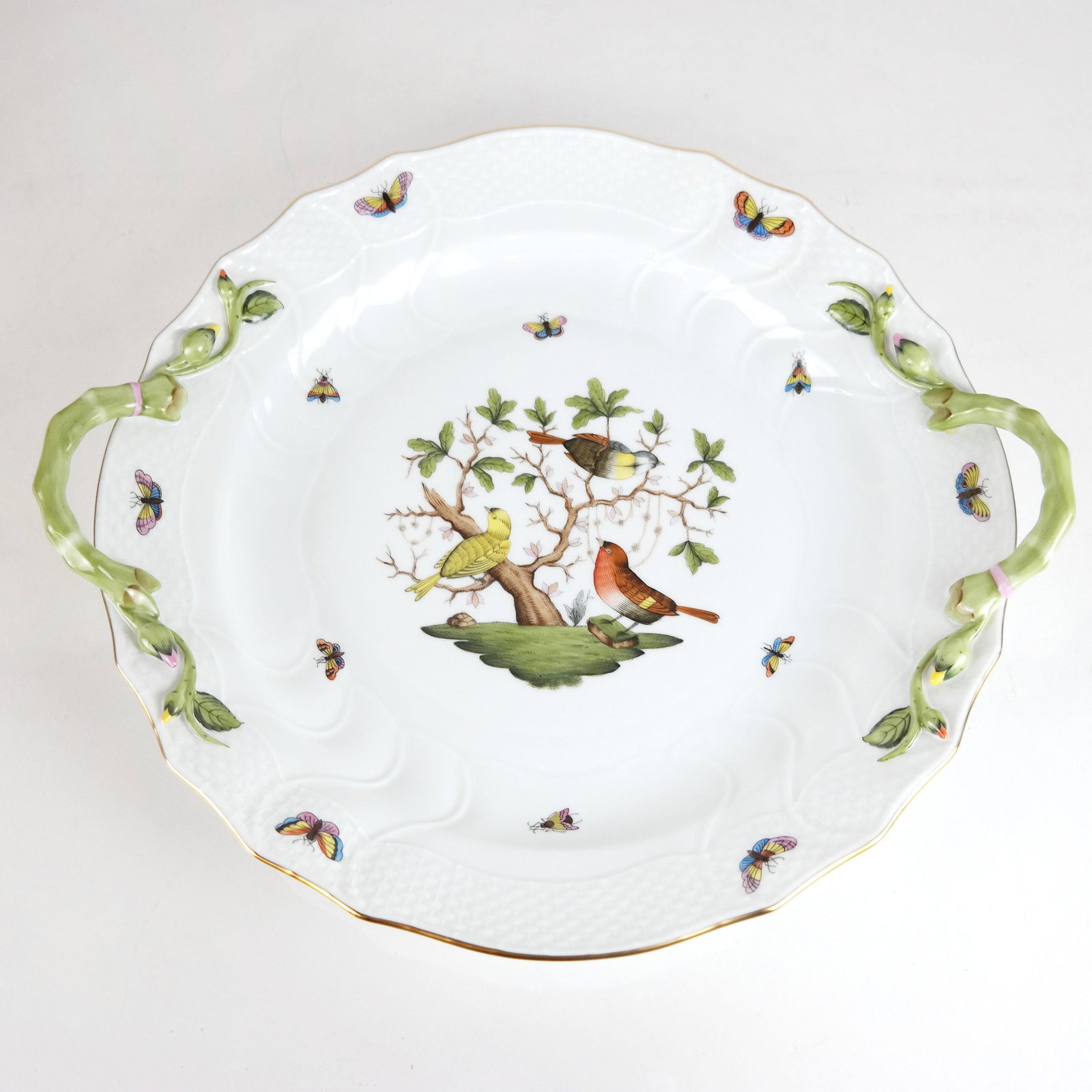 Herend Porcelain Round Shallow Bowl: Herend porcelain round shallow bowl, with two handles, in Rothchild pattern. [3" H x 16" W x 14" D].