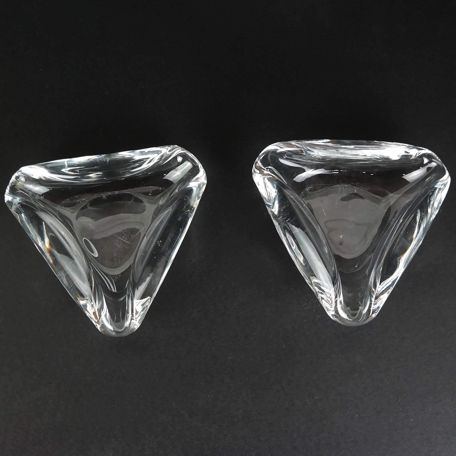 Pair of Baccarat Crystal Ash Trays: Pair of Baccarat crystal triangle fold form ash trays. [6 1/2" Diam.].