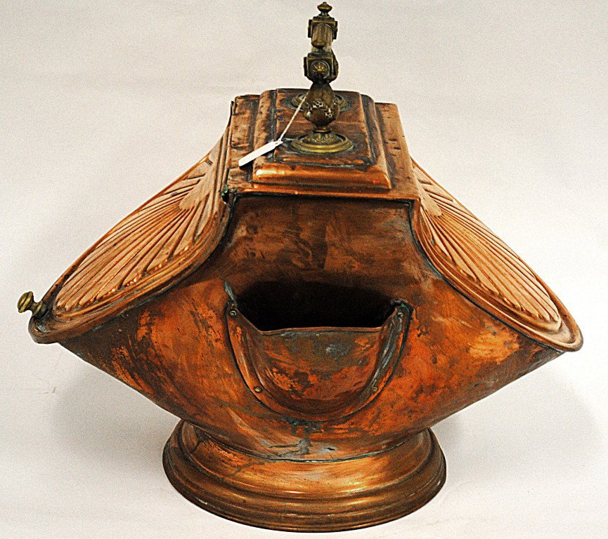 Copper Coal Scuttle: Copper coal scuttle with repousse shell motif and brass hardware. 22"W x 12-3/4"D x 18-1/2"H.