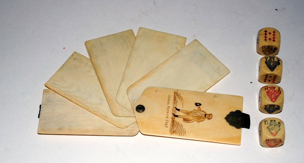 Ivory Aide Memoire and Four Dice: Aide Memoire with six pages. Front cover bears an engraved depiction of a 19th century gentleman below which is inscribed "Samuel Pickwick Esq." 1-1/2"W x 1/8"D x 3-1/8"H. Accompanied by four dice wit