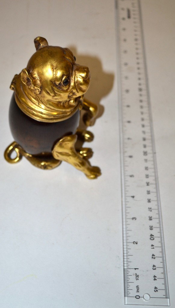Tobacco: Seated Bull Dog Tobacco Jar With Dore Bron: Naturalistic Seated Bull Dog Tobacco Jar With Dore Bronze Mounts. Bears a rosewood torso and glass eyes. 3-1/4"W x 4-3/4"D x 6"H.