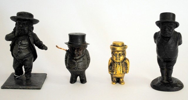 Tobacco: Four Figural Mechanical Smoking Accessor: Group of Four Figural Smoking Accessories. Comprises two cast iron cigar lighters and two match safes, one cast iron and one brass. All bear various men's hats and are hinged at the back. Heights vari