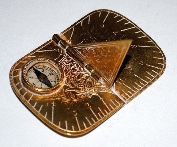 Dore Bronze Compass and Sun Dial, 1875 Birmingham: 1875 Birmingham Dore Bronze traveling compass and sun dial. Closed: 1-1/4"W x 1-3/4"D x 1/8"H. Open: 2-3/8"W x 1-3/4"D x 1-1/8"H.