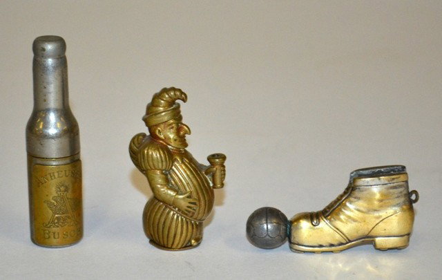 Tobacco: Three Small Gadgets: Three Figural gadgets comprising a brass "Punch" match safe, a soccer ball and boot lighter, and an Anheuser Busch bottle form cork screw. Dimensions variable from 2-1/4"W x 2-3/4"H.